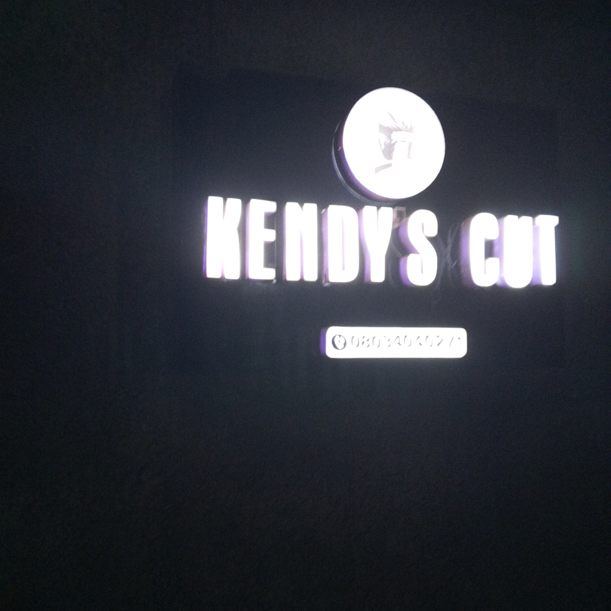 Evening barbershop visit documented in Enugu, Nigeria