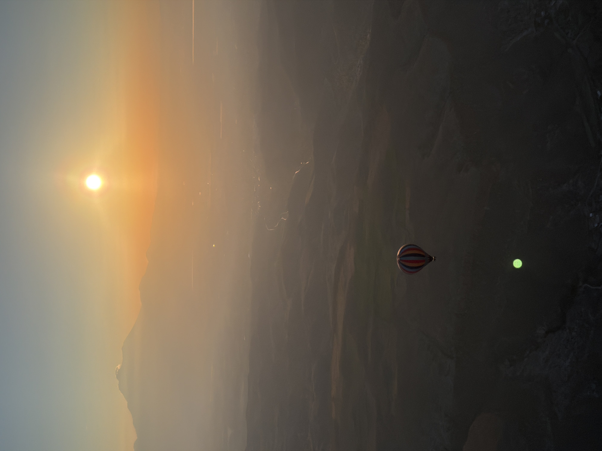 Hot air balloon captures sunrise over Turkish mountain landscape