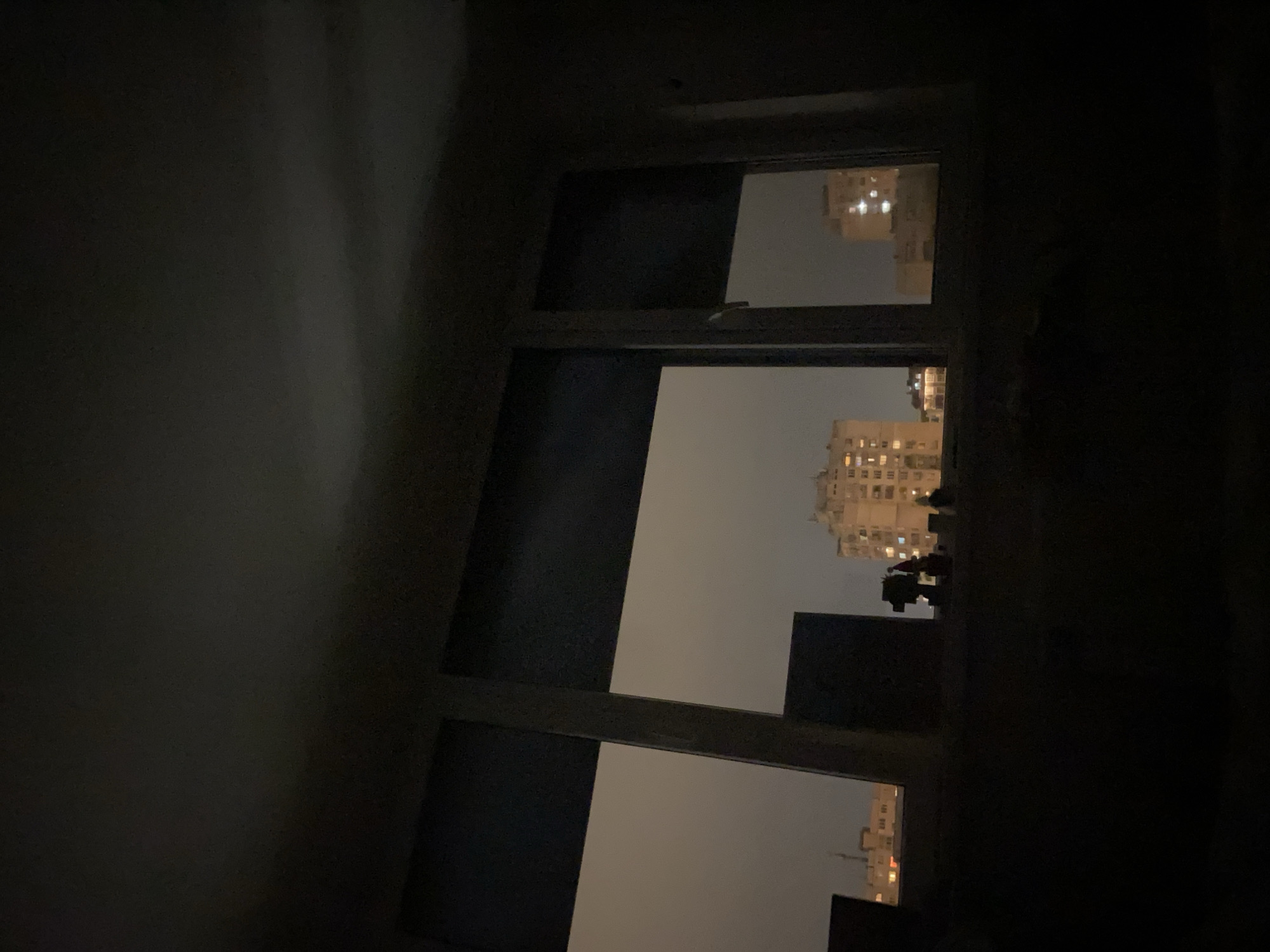 Nighttime city skyline view captured from window in Sofia