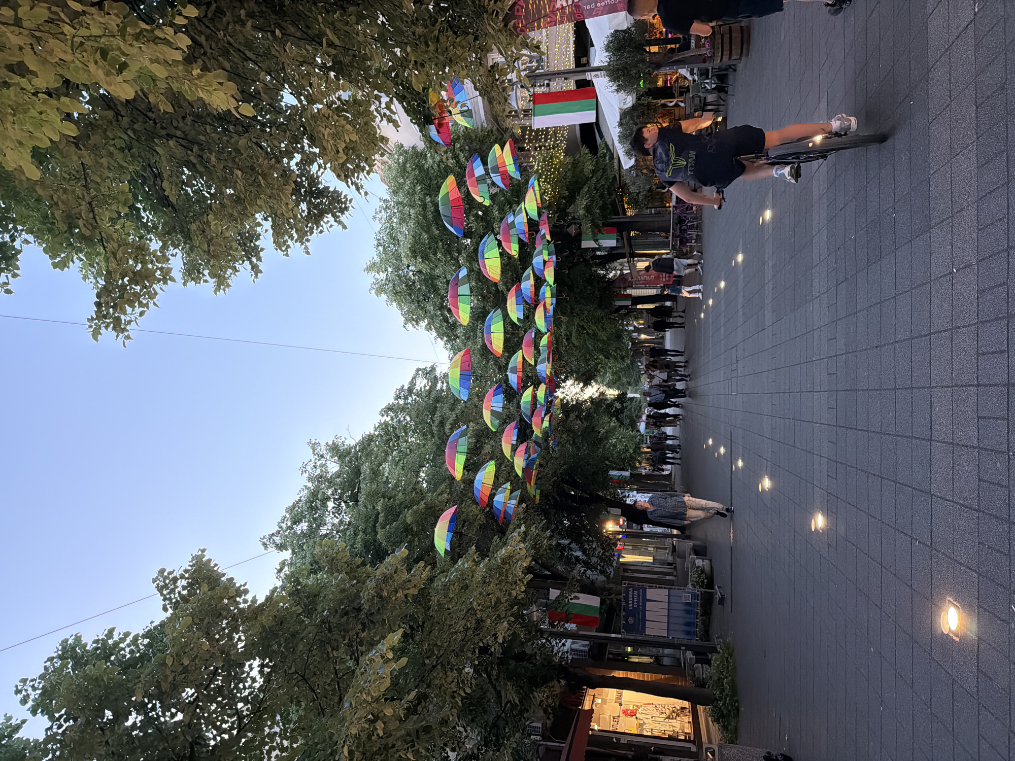 Rainbow umbrellas and city landmarks documented in Burgas, Bulgaria