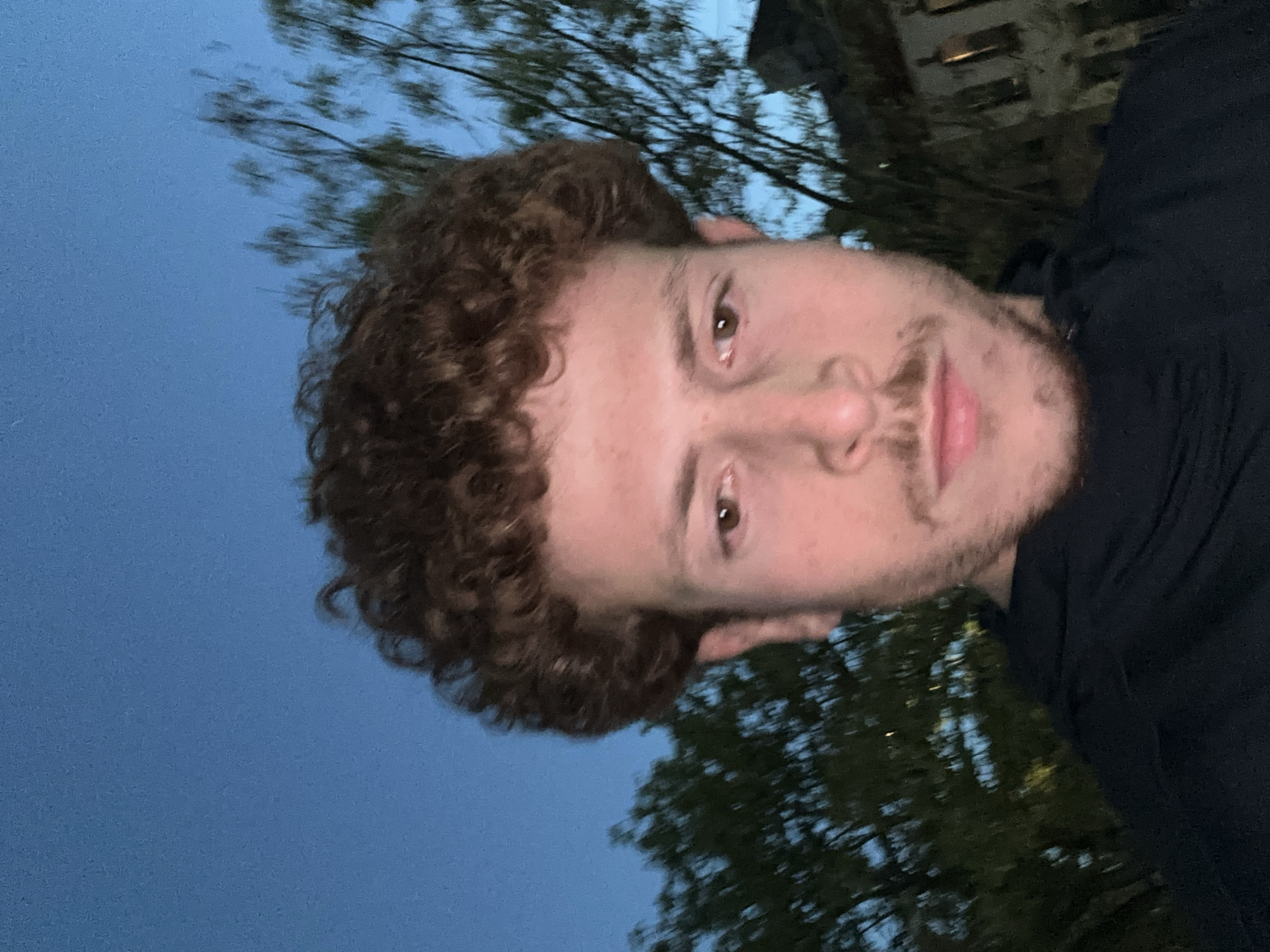 Young man takes evening selfies in New York