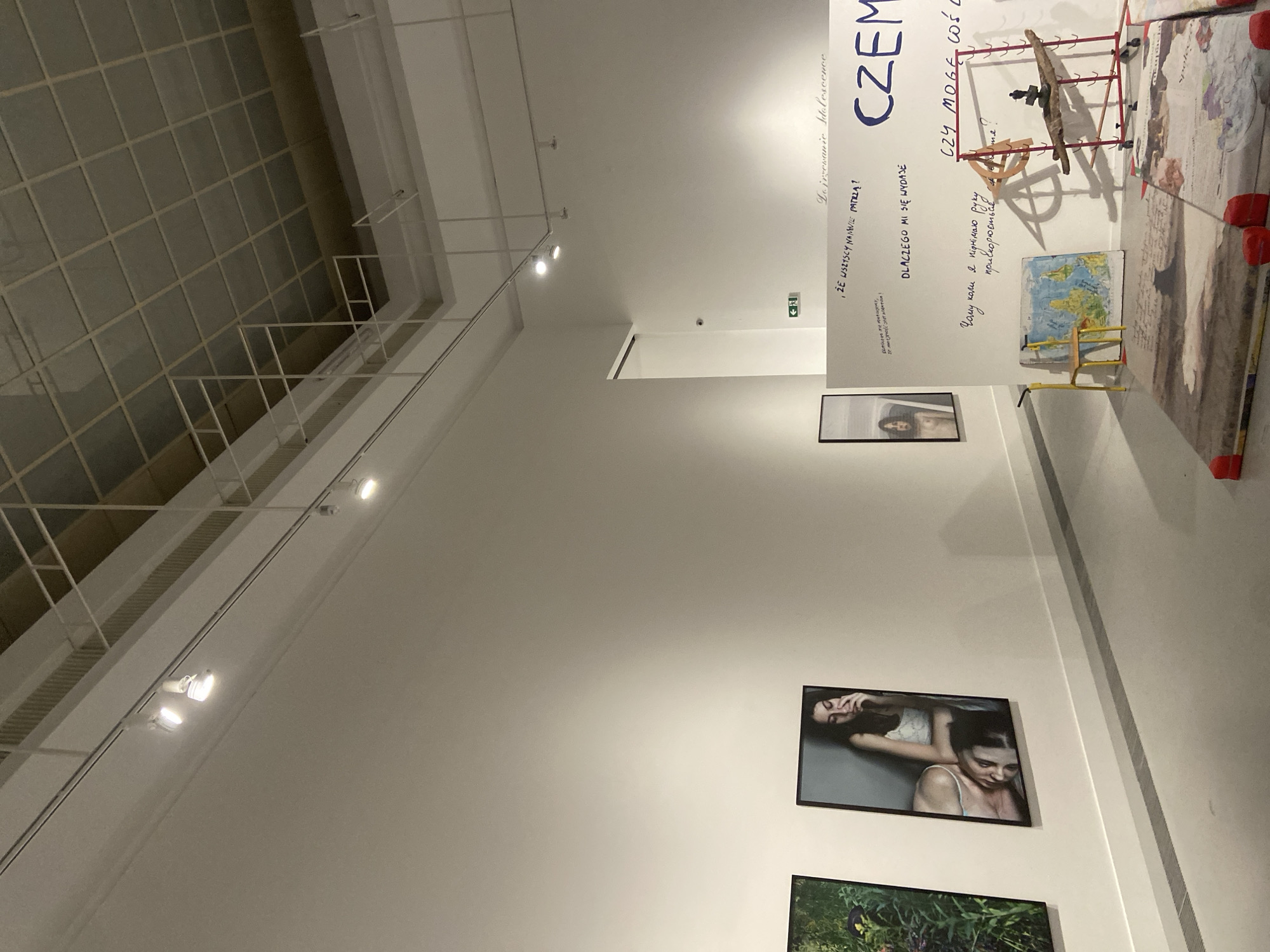 Inside a Warsaw contemporary art exhibition, mid-afternoon