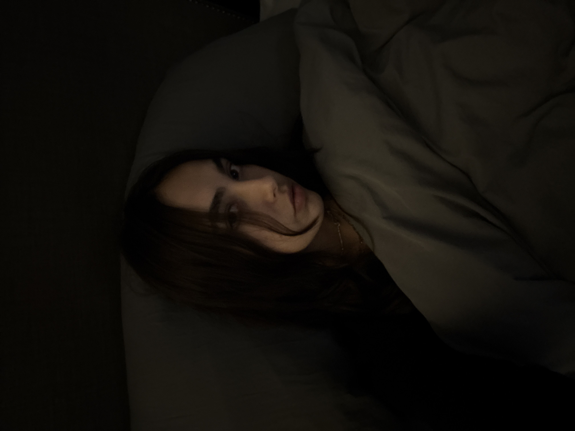 Person photographed in bed in Mexico City morning