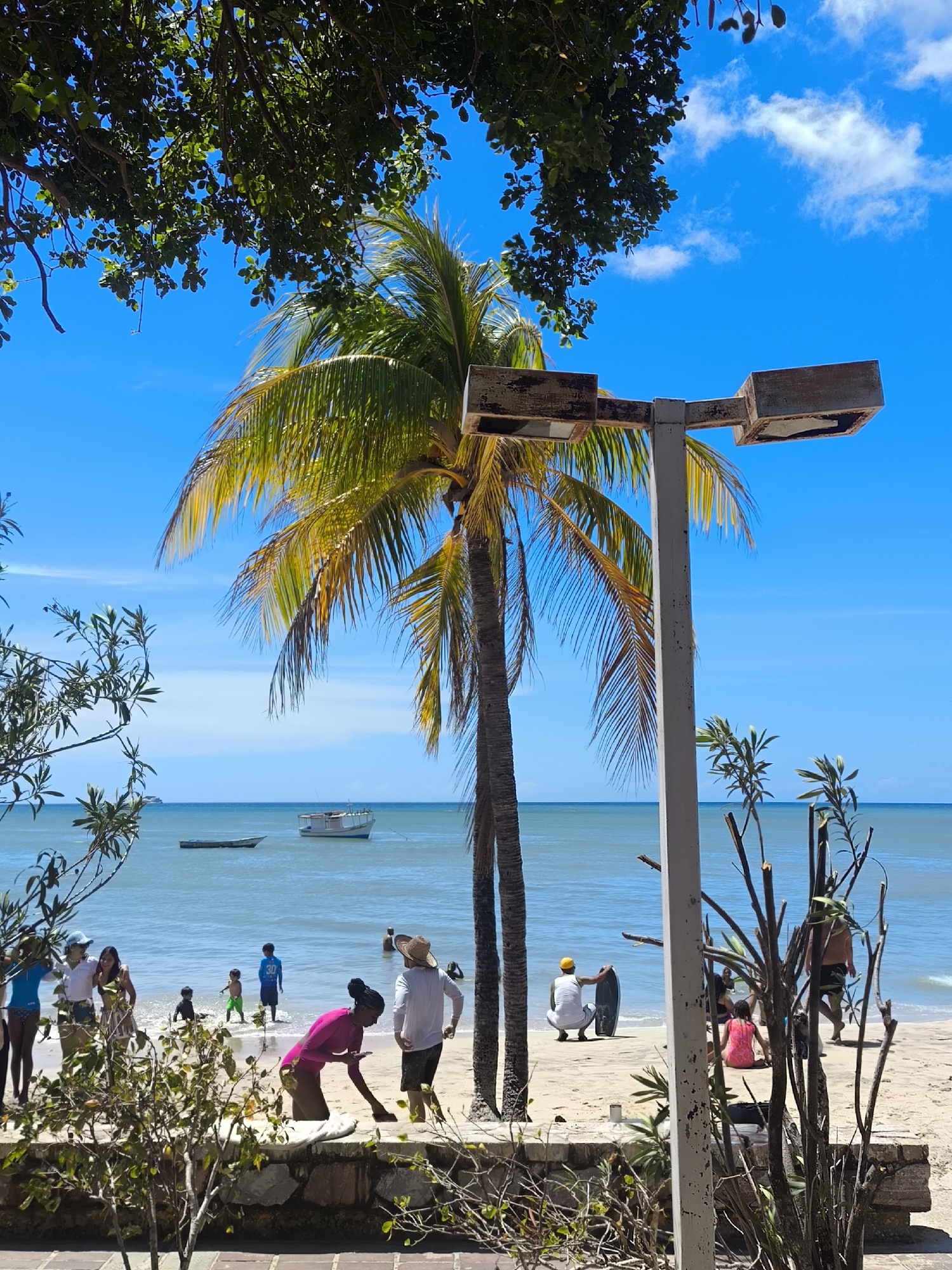 Beach activities and building views captured in Pedro González