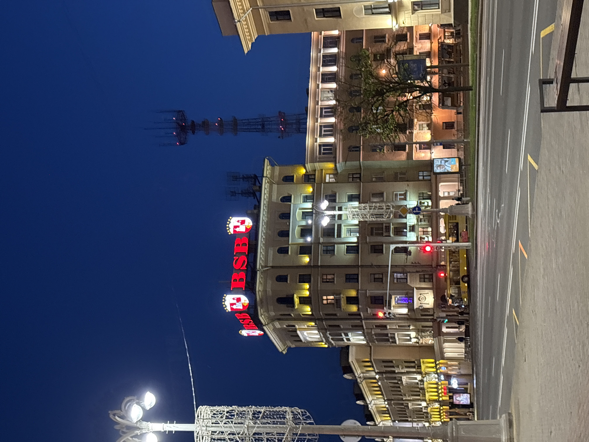 Evening scenes documented across central Minsk under crescent moon