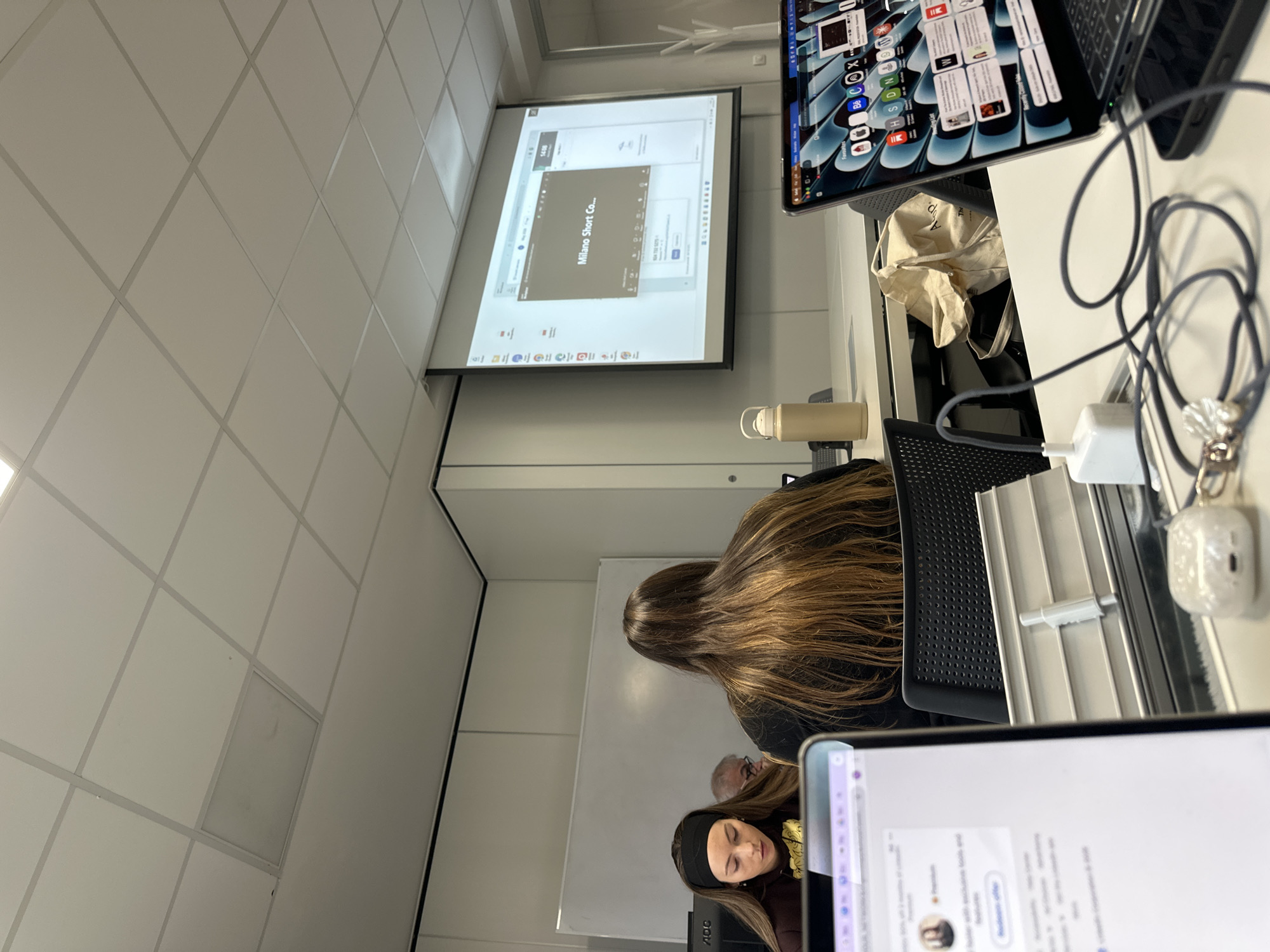 Fashion presentation documented in Milan classroom setting