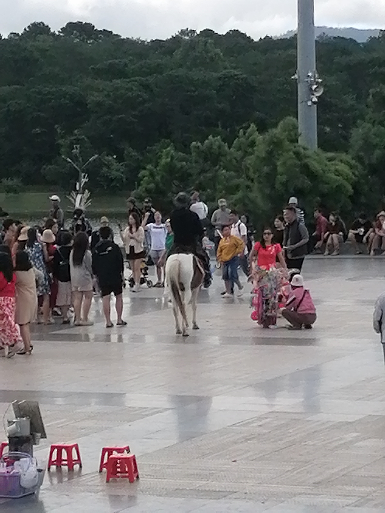 Street life and a living statue in a Da Lat plaza