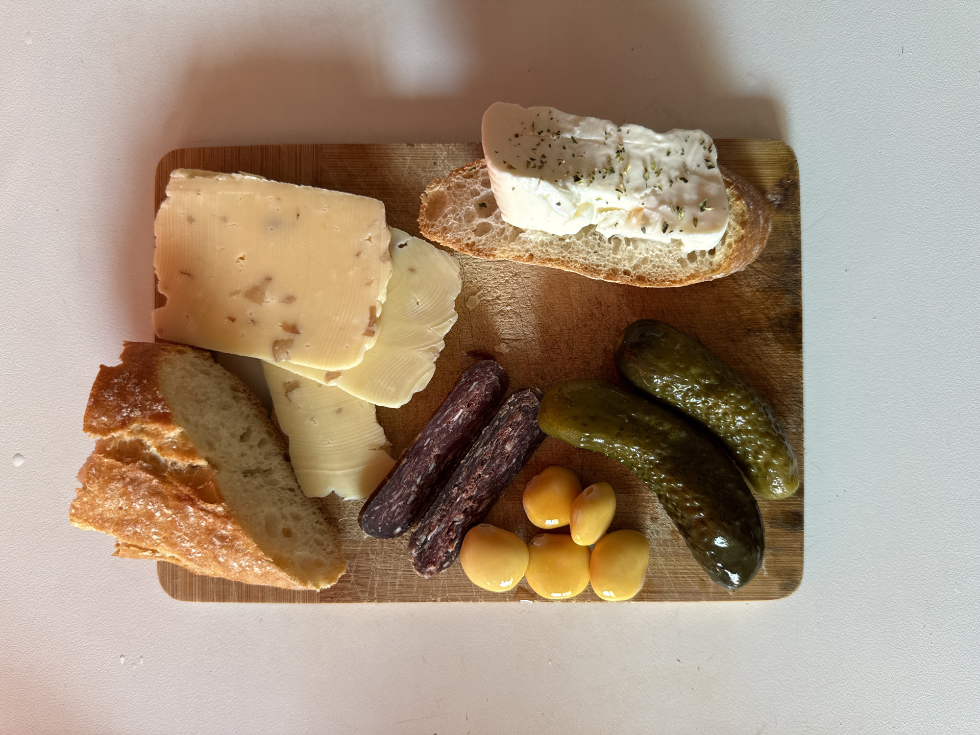 Food arrangement photographed on wooden cutting board in Milan