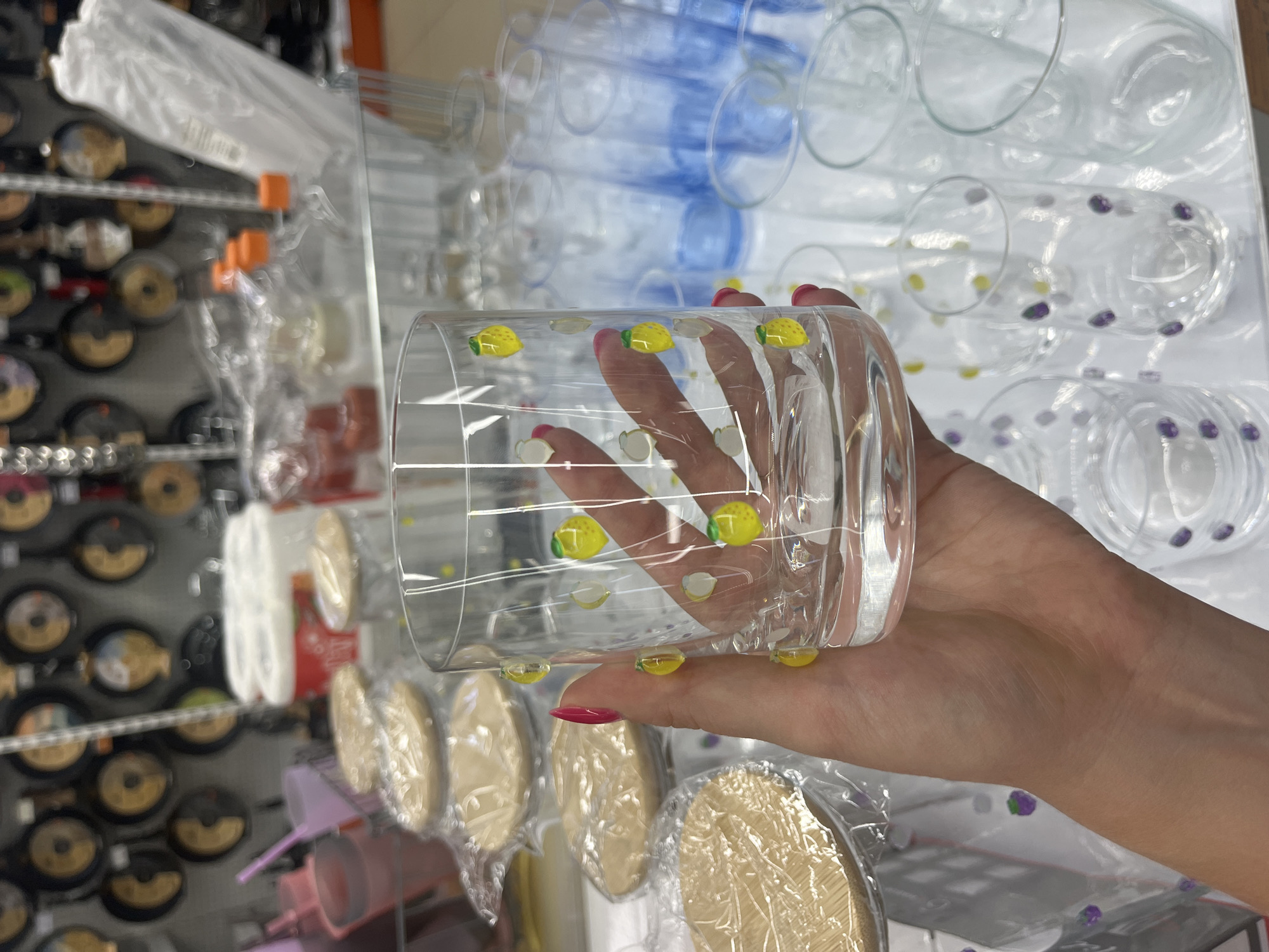 Browsing glassware and woven accessories in a Chelyabinsk shop