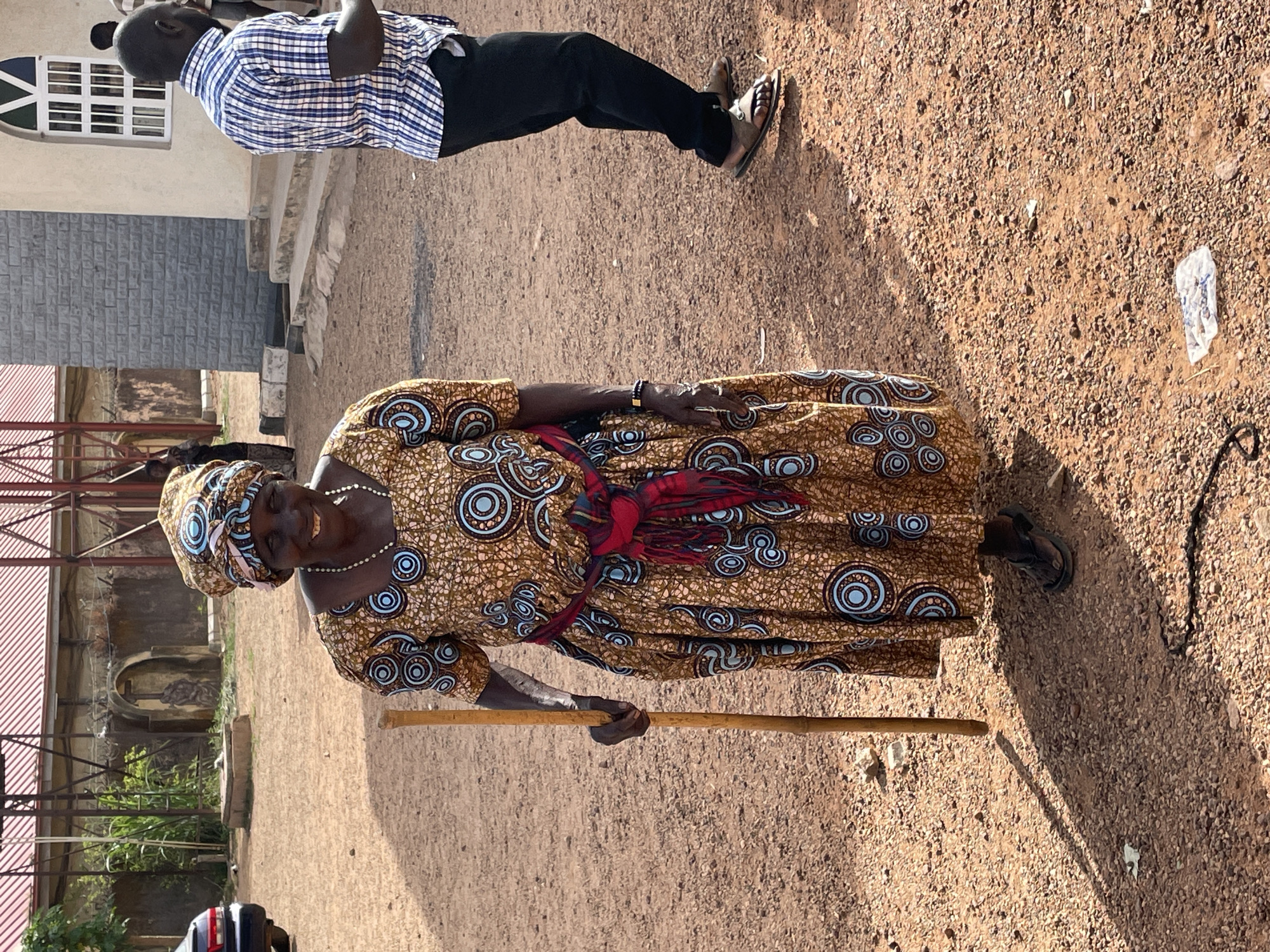 Woman with papers gathers with crowd in Jos, Nigeria