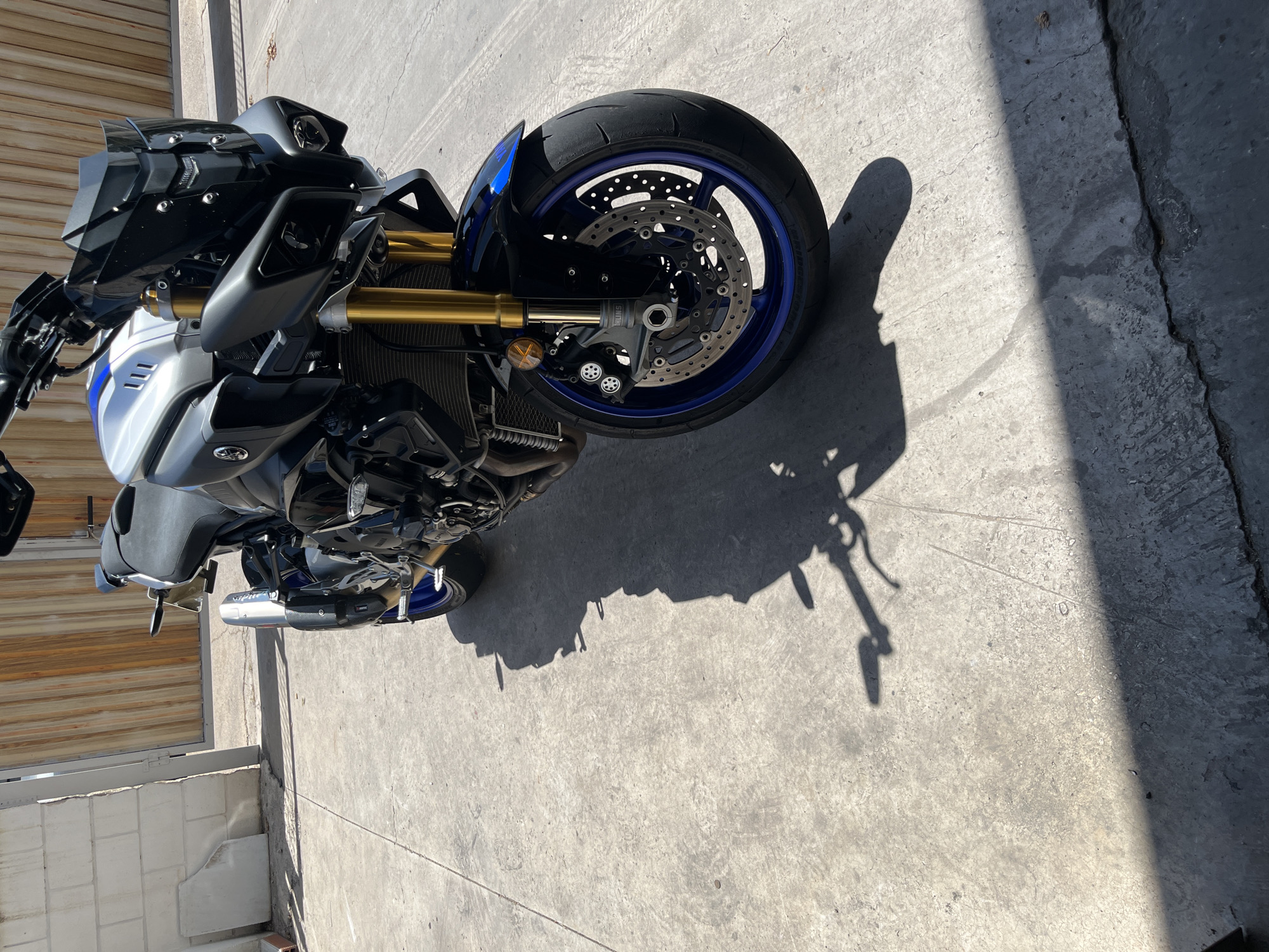 Yamaha motorcycle parked in sunny Xeraco facility