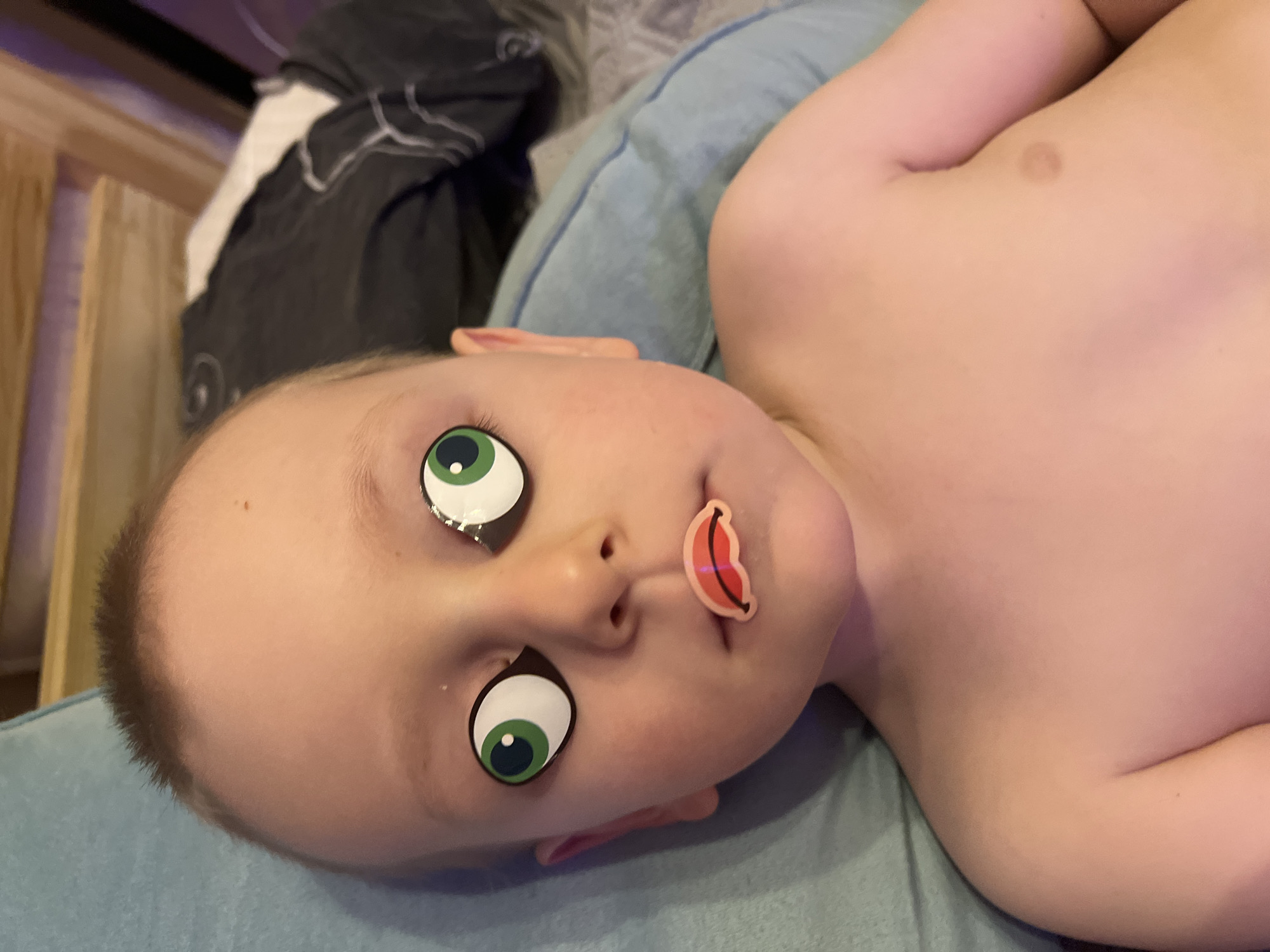 Child plays with toys, wears cartoon stickers in Mytishchi home