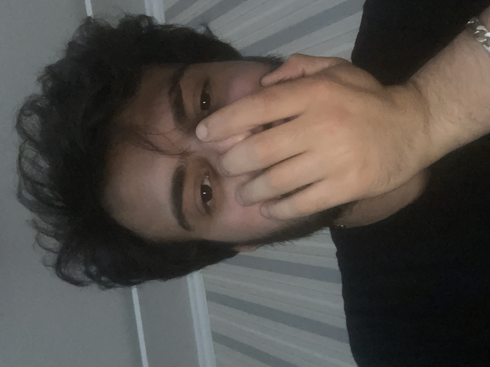 Young man takes multiple selfies in Tbilisi residence