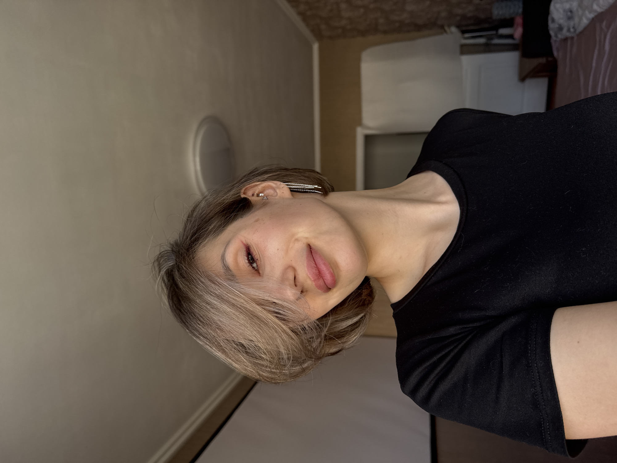 Person takes selfies in decorated indoor room