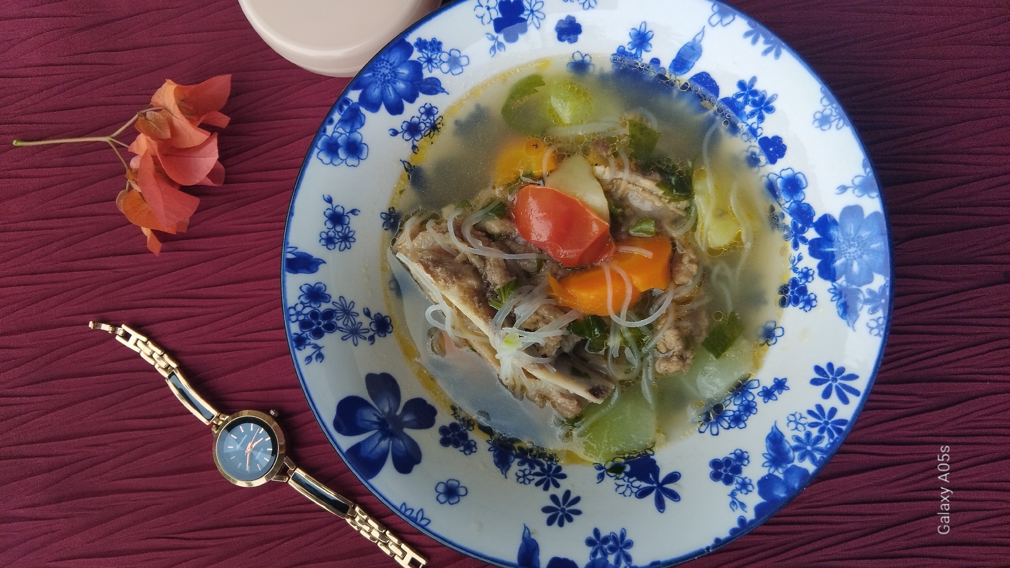 Food, a watch, and backyard plants in rural Indonesia