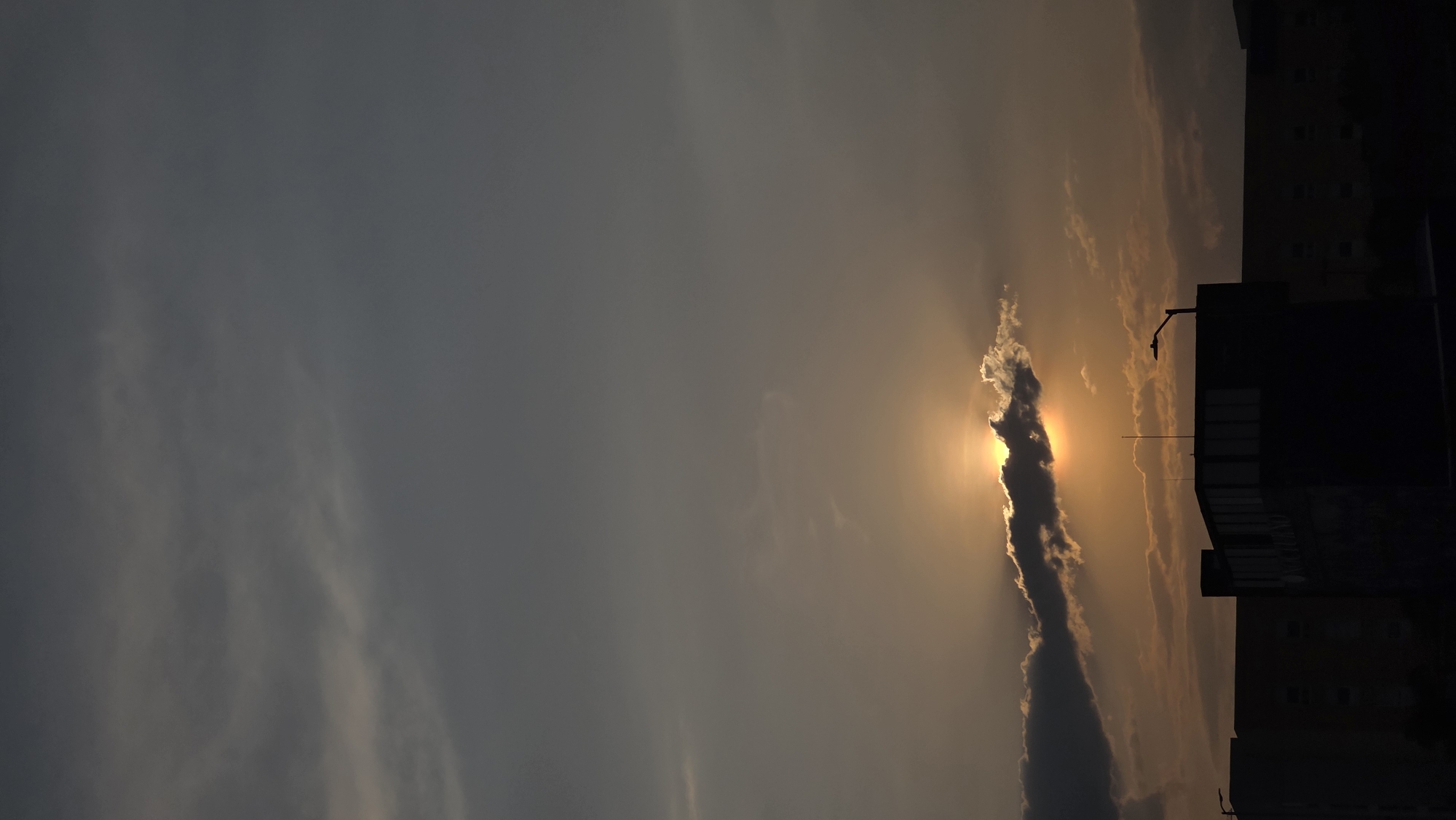 Golden sunlight breaks through clouds over Puebla, Mexico