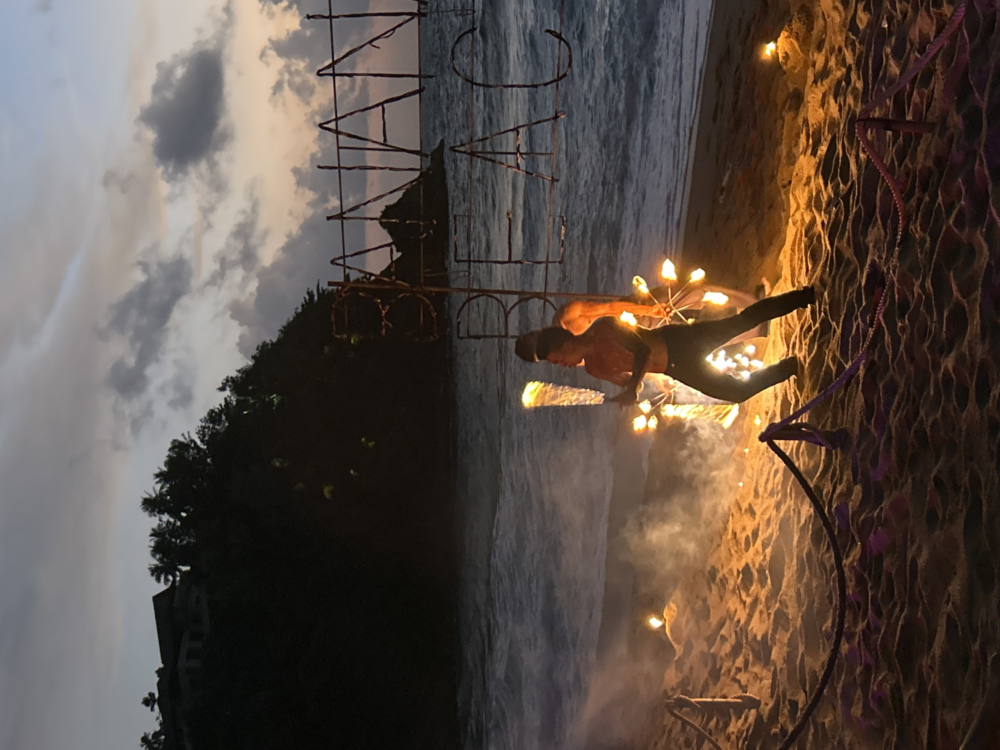 Fire performance at Banana Beach, Choeng Thale, at dusk
