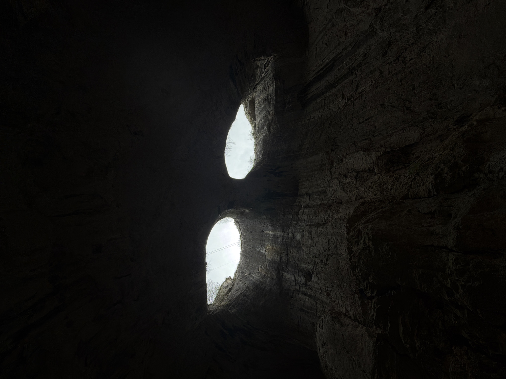 Tourist captures Prohodna Cave's famous ceiling openings in Bulgaria