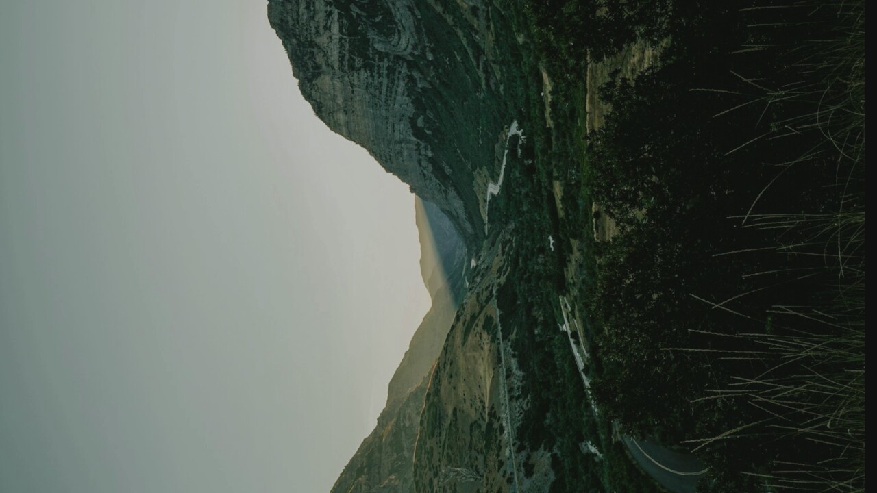 A scattered mix of landscapes, cityscapes, and traditional dress