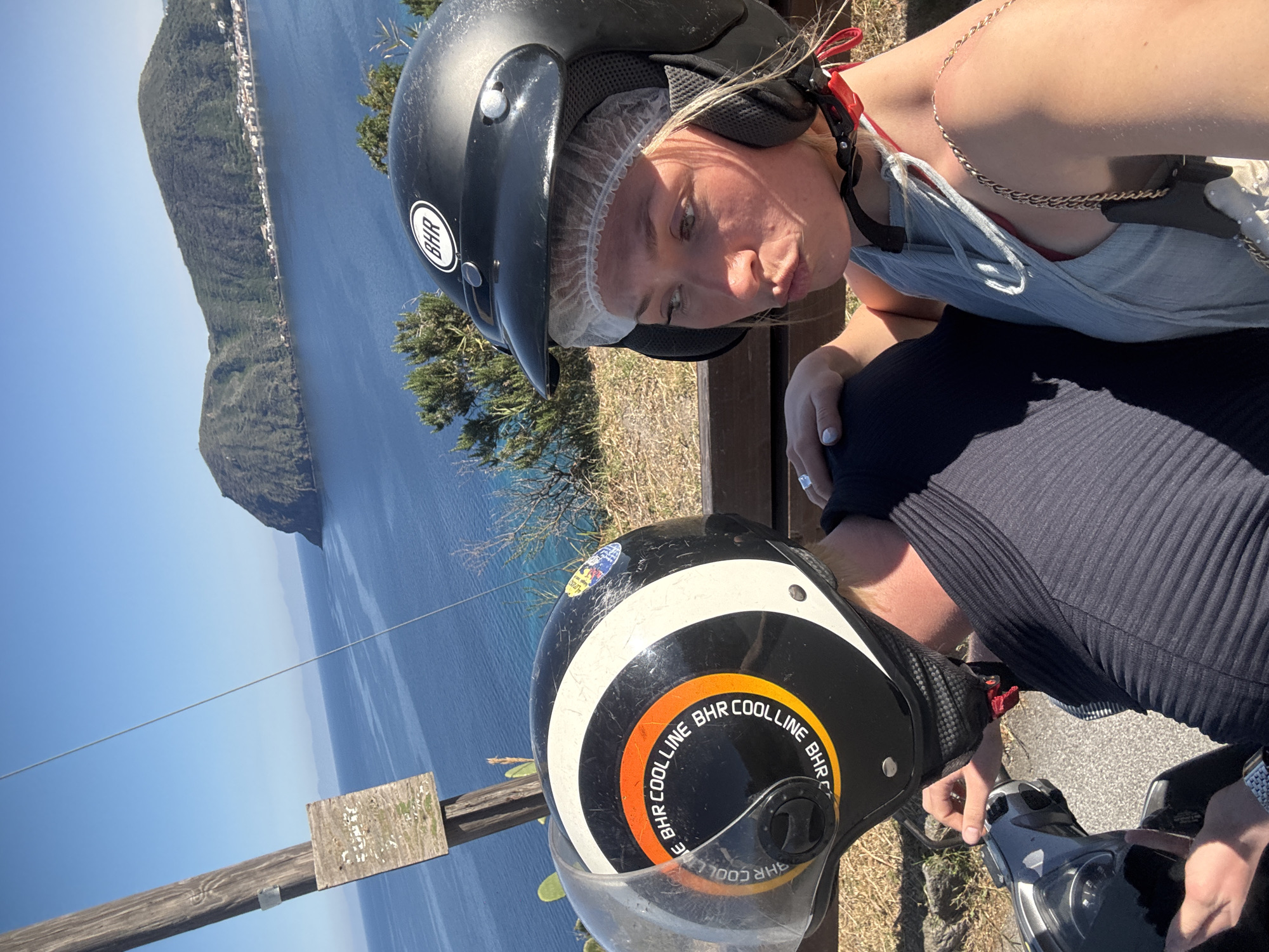 Tourists pause for scenic photos during Lipari scooter ride