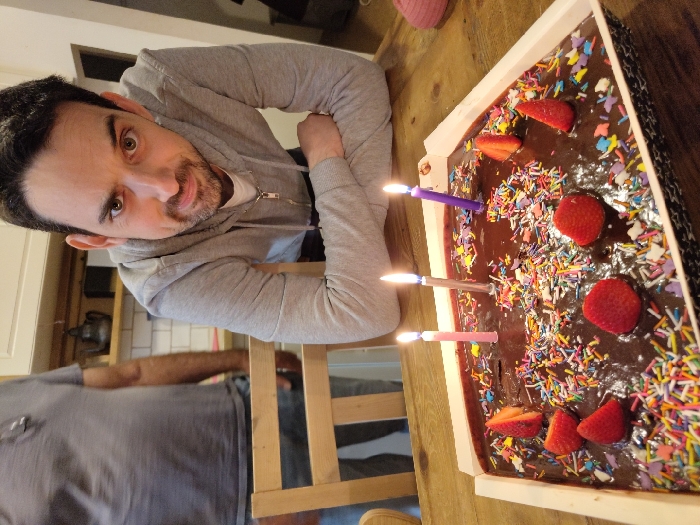 Birthday celebration with chocolate cake documented in Tel Aviv residence