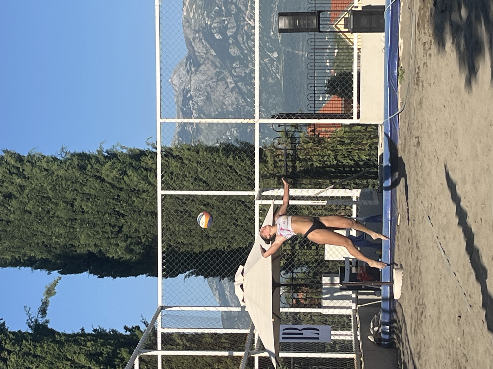 Beach volleyball match and sideline scenes in Gošići, Montenegro