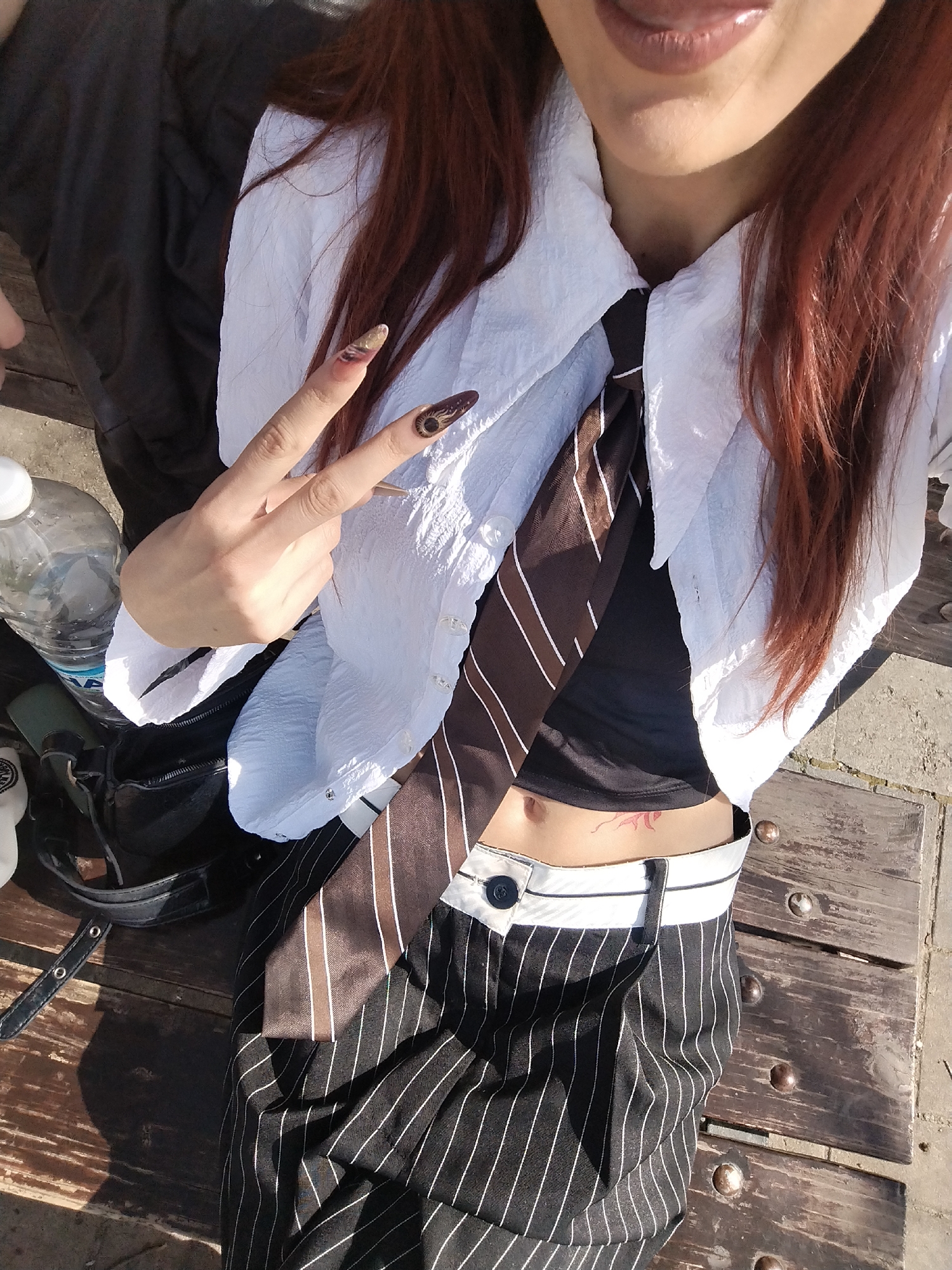 Person photographed with belongings in outdoor Sofia setting