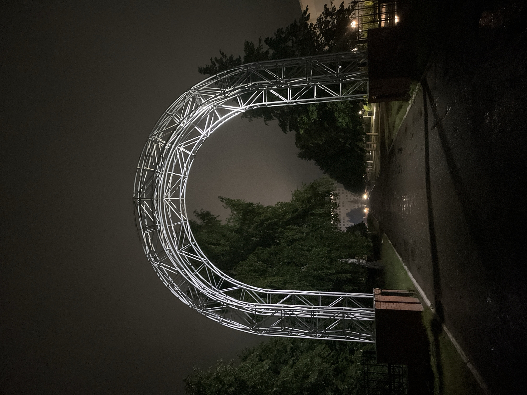 Night visitor documents illuminated archway in Chaikovsky, Russia