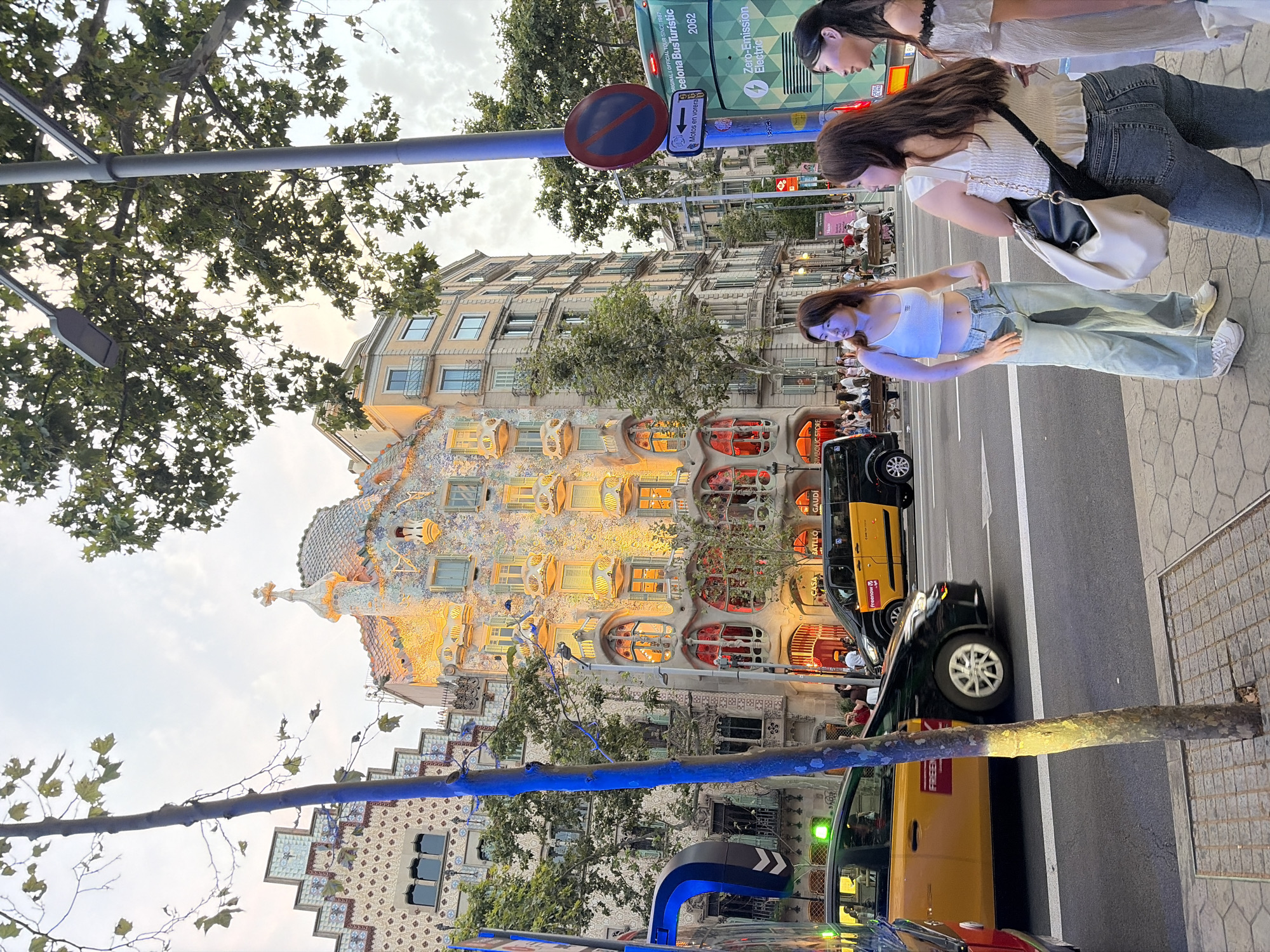 Casa Batlló illuminated at night, Passeig de Gràcia traffic flowing