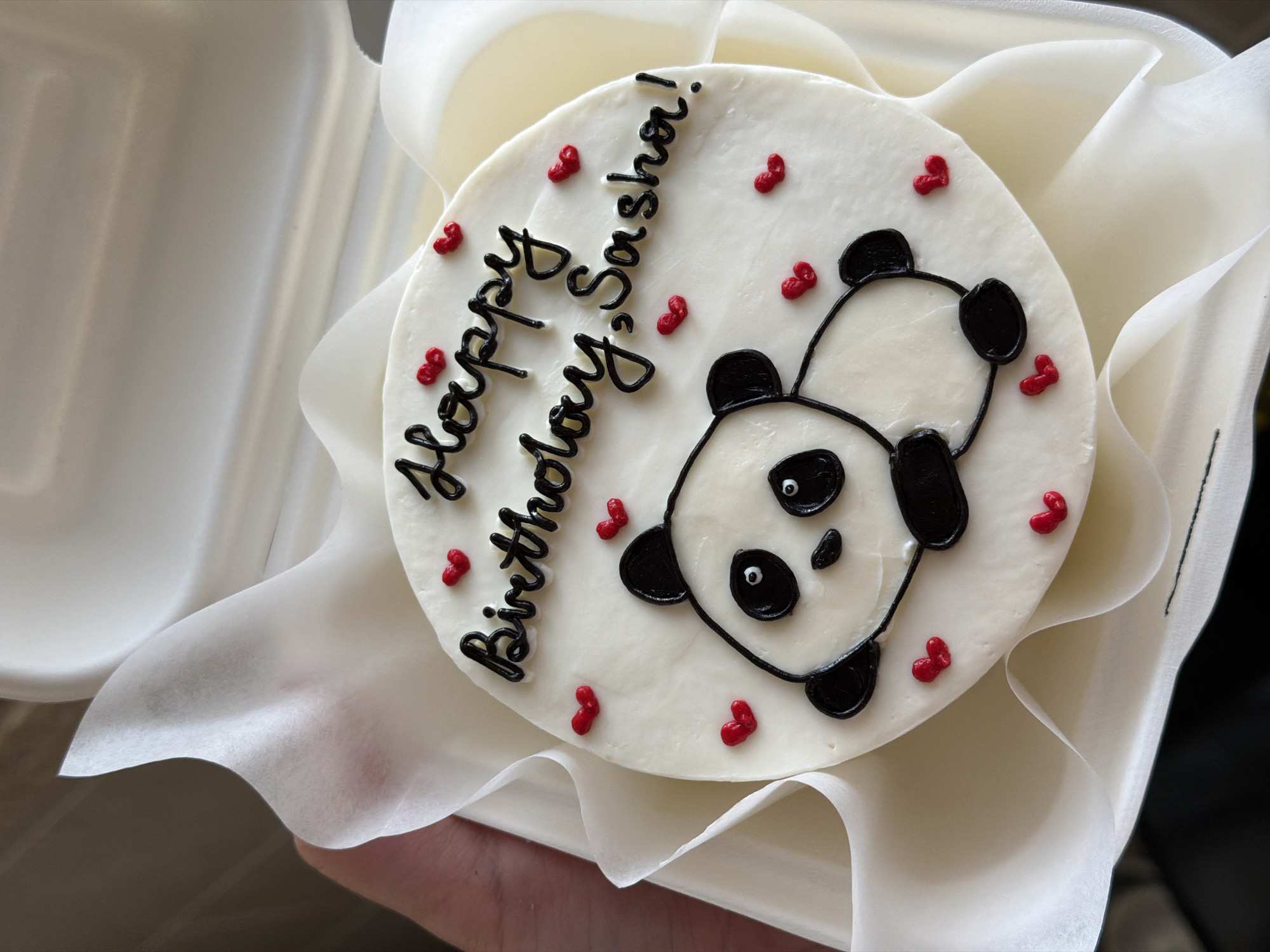 Birthday cake for Sasha photographed in Bat Yam takeaway container
