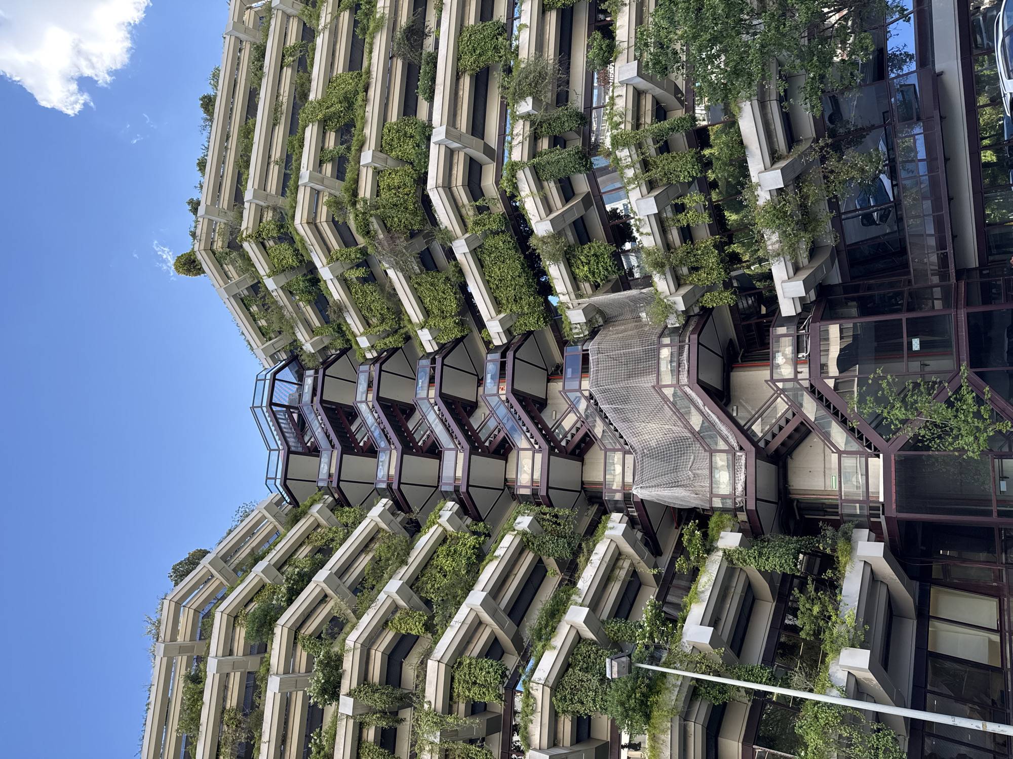 Barcelona building with angular concrete balconies captured by witness