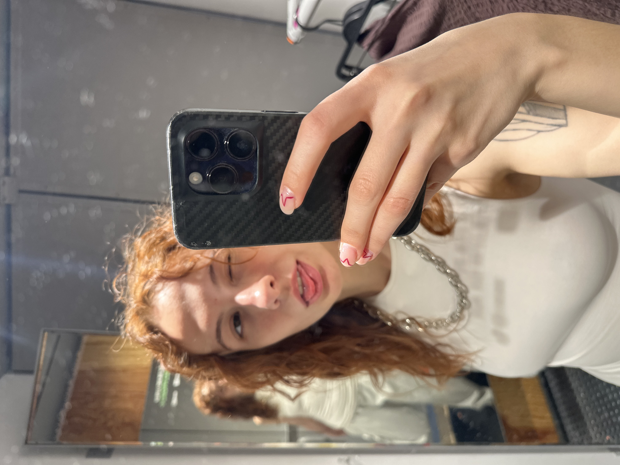 Woman photographs herself near Aleksandar Tišma mural in Novi Sad