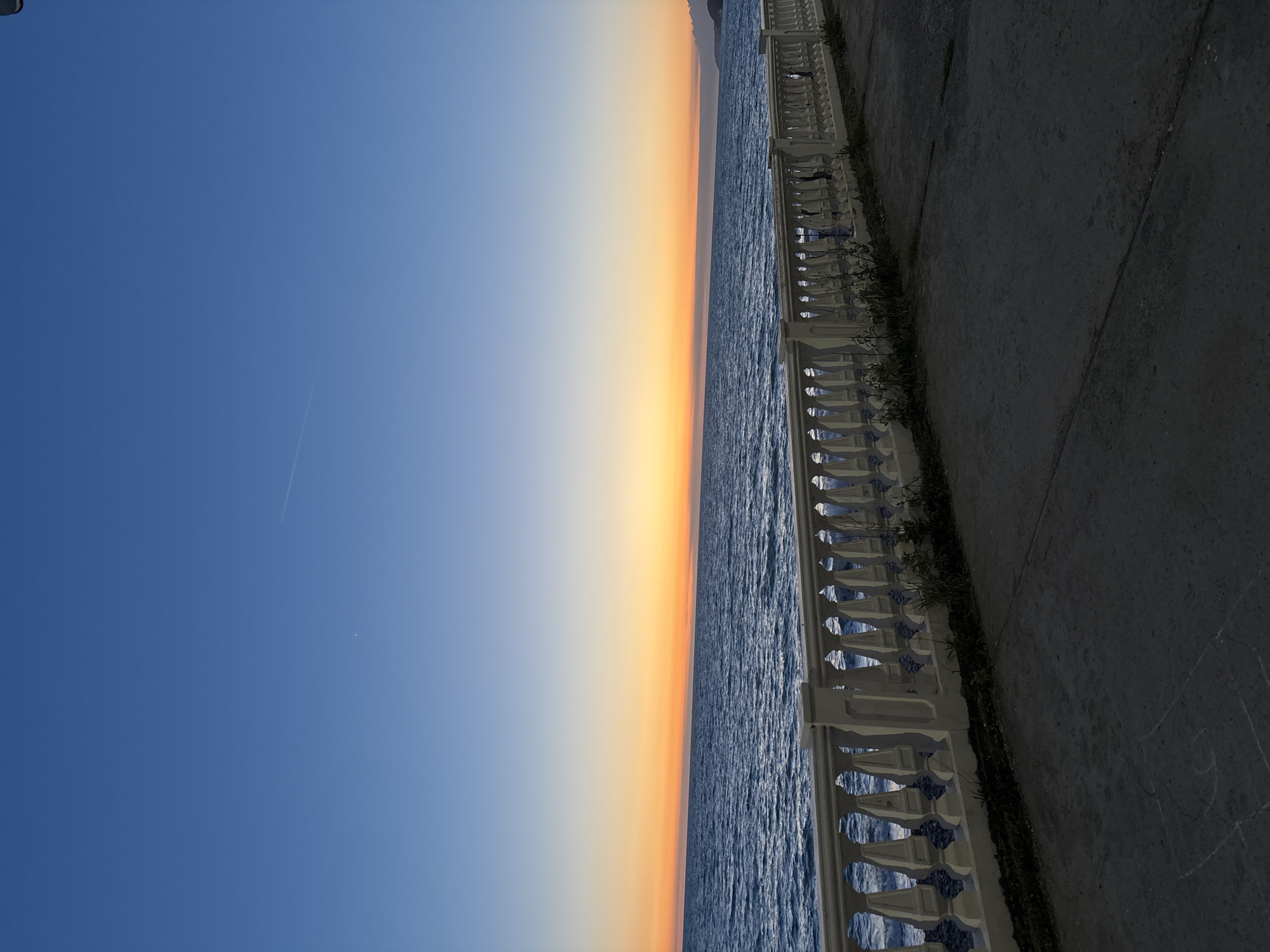 Coastal promenade scene captured during sunset in Sochi, Russia