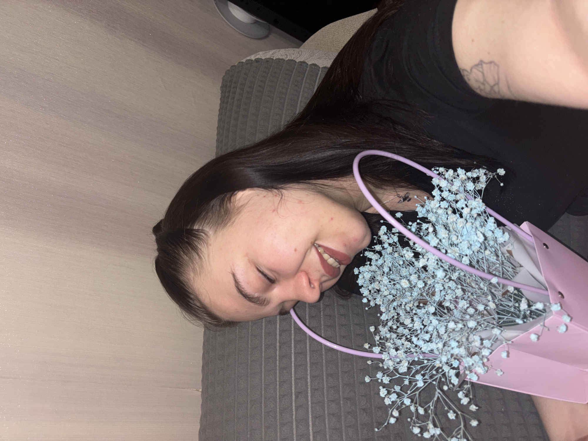 Woman relaxes at home in Perm during Saturday afternoon