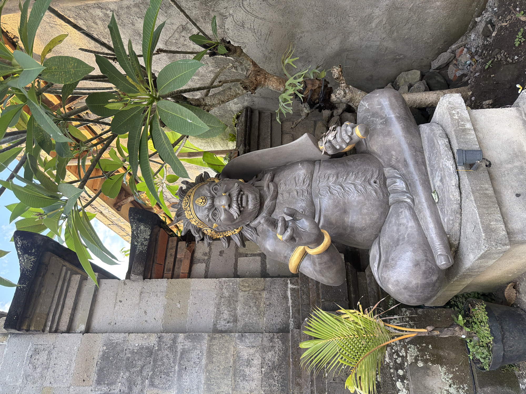 Ubud streets, temple gates, and cremation ceremony preparations