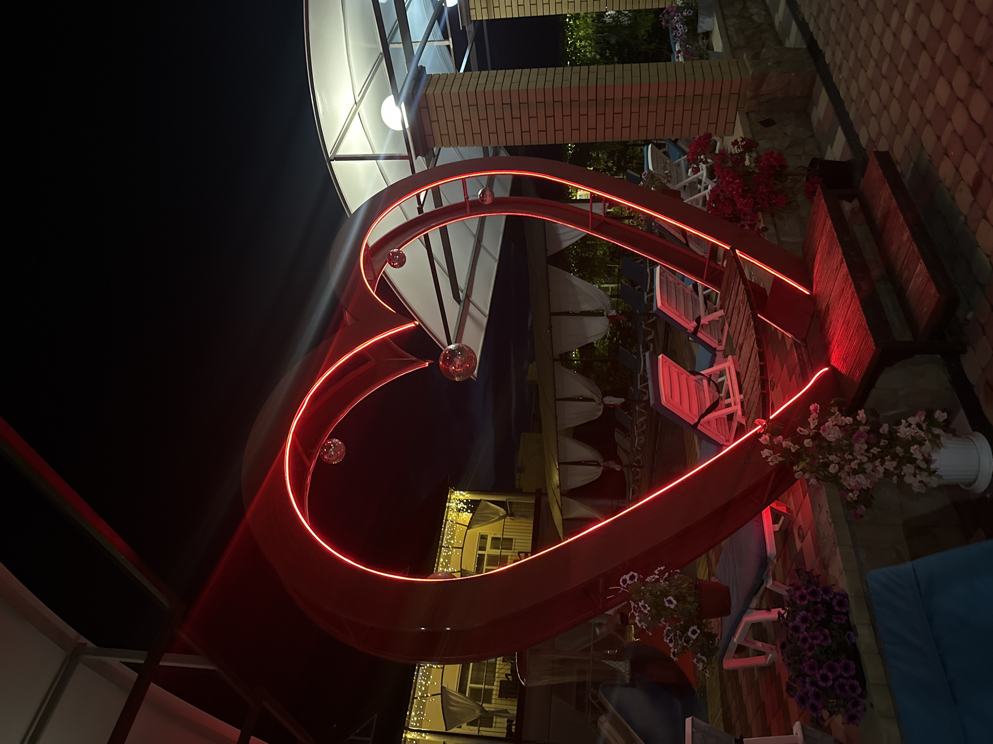 Neon-lit outdoor venue glows at night in Yaroslavskaya