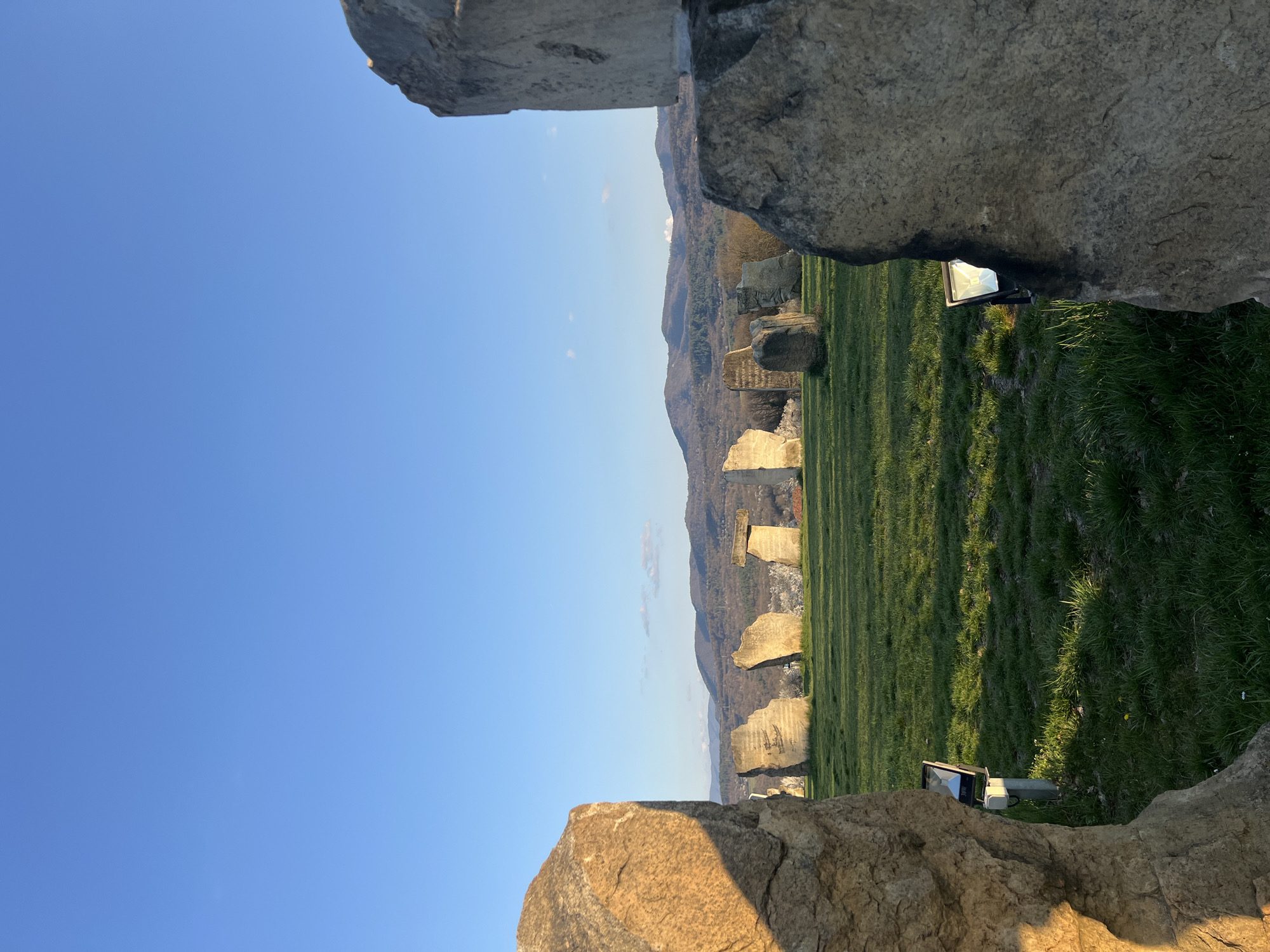 Tourist documents Bulgarian village landmarks and monuments during afternoon visit