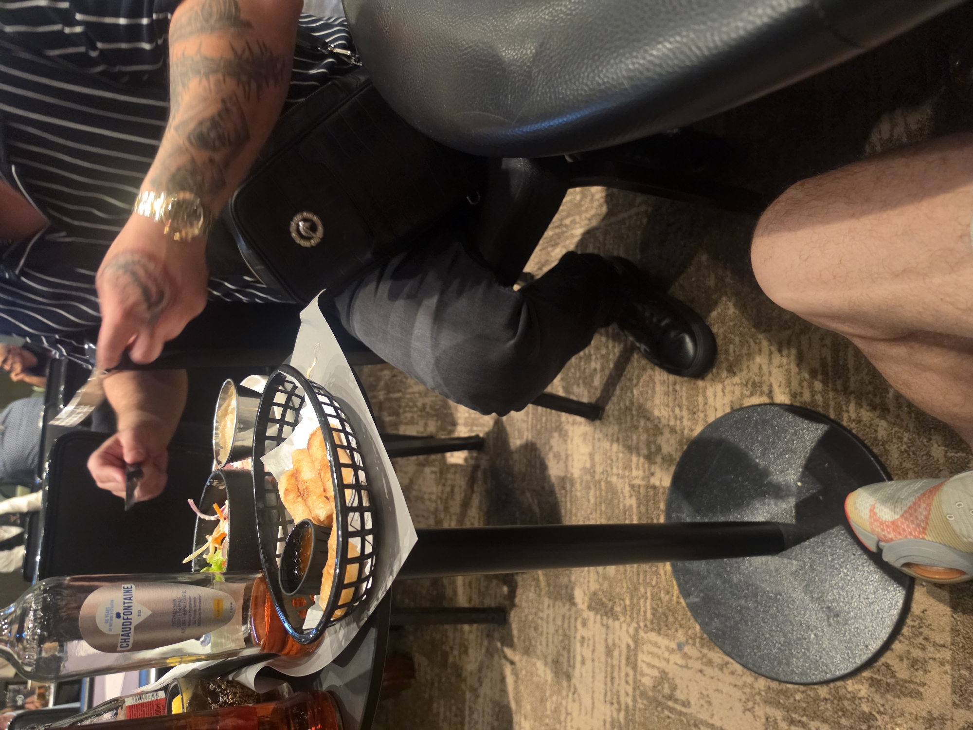 Food, drinks, and poker chips at an indoor table session