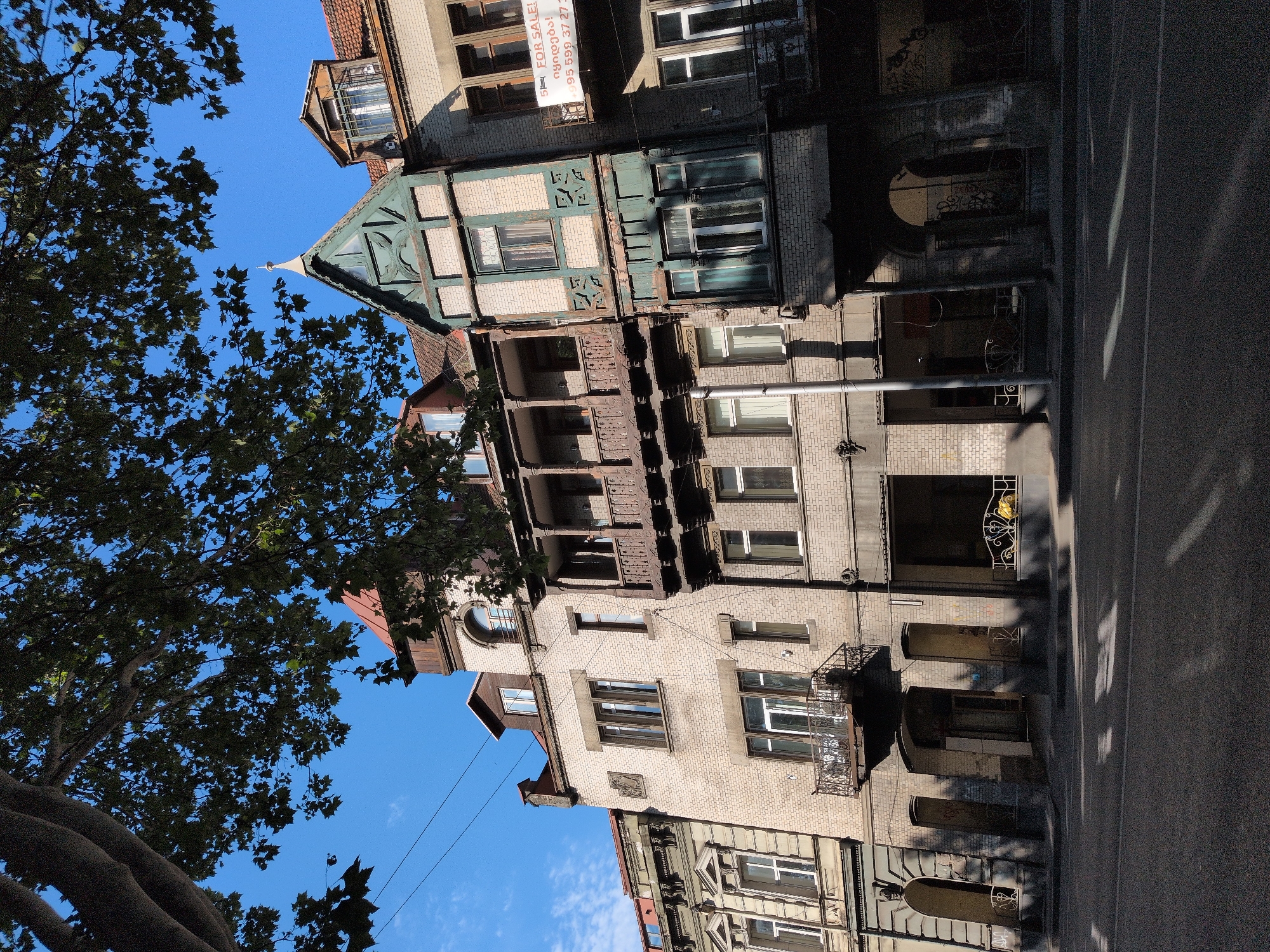 Tbilisi street scenes featuring ornate stonework and historic facades