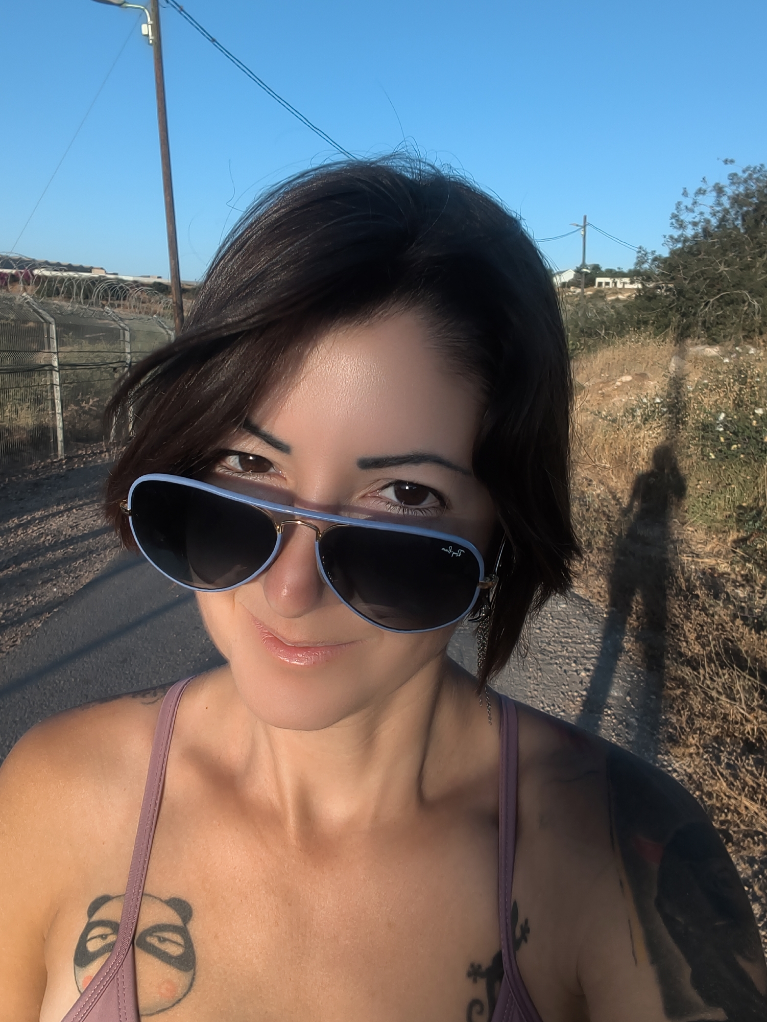 Woman photographed in rural Israeli countryside during golden hour