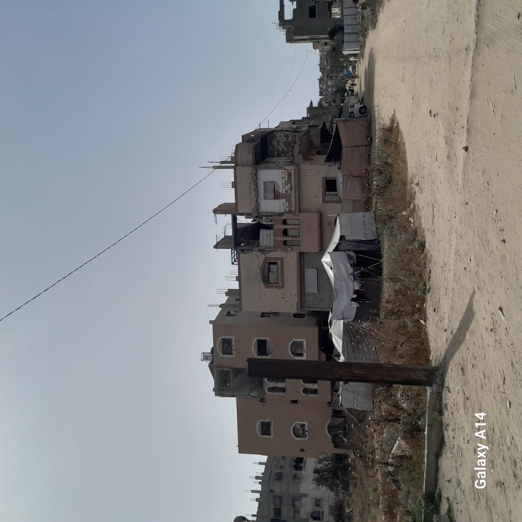 Damaged buildings documented on Nuseirat street, Palestinian Territories