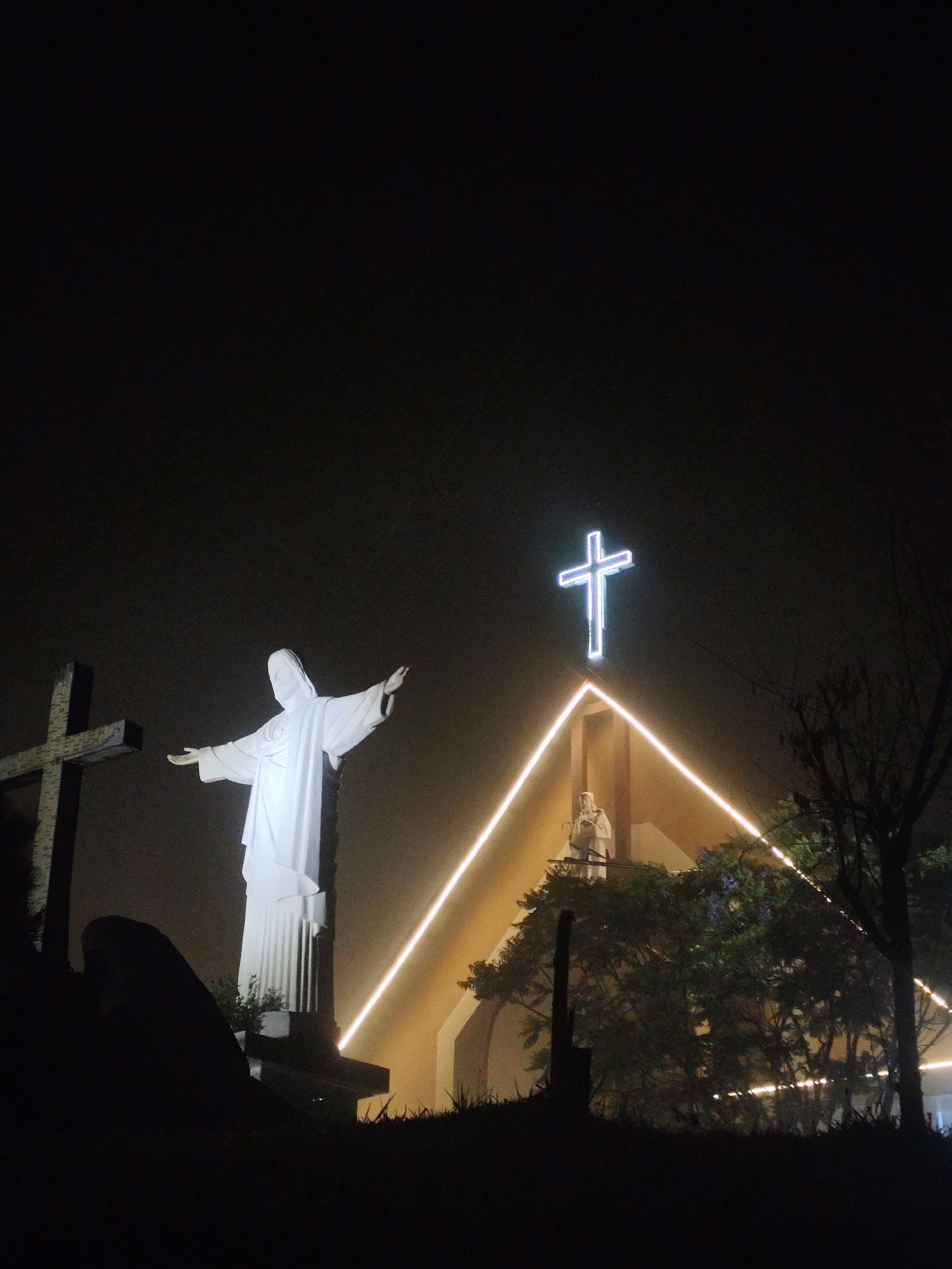Nighttime religious site and street scenes documented in Da Lat