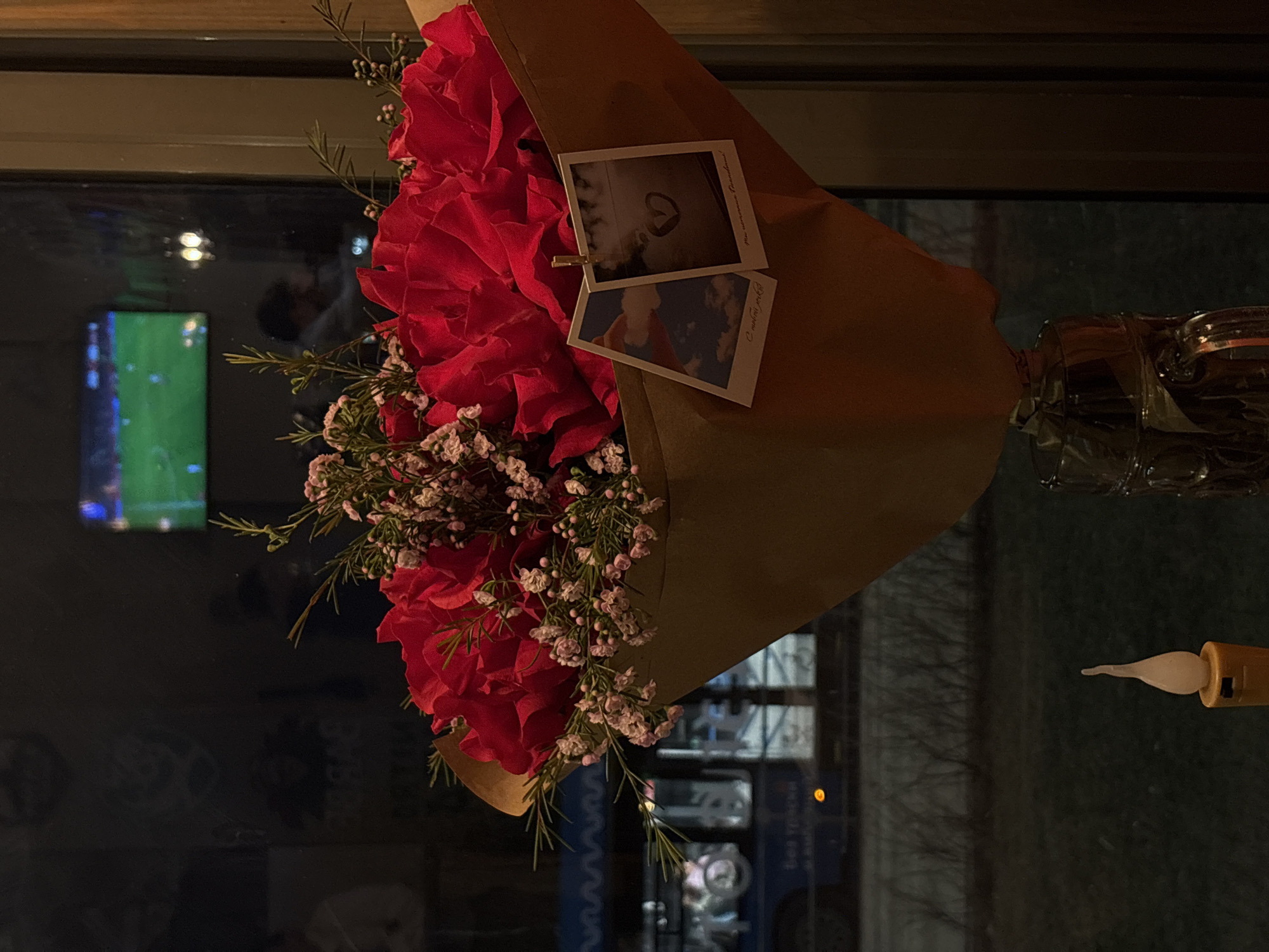 Red rose bouquet with Polaroid photos captured in Moscow