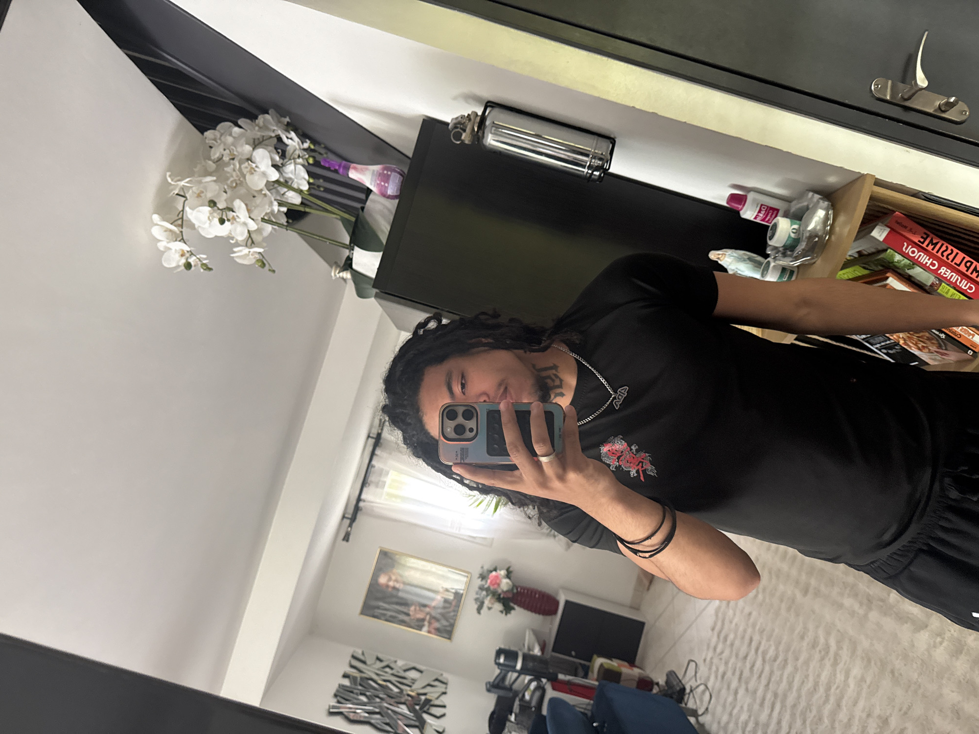 Young man takes multiple selfies in French village