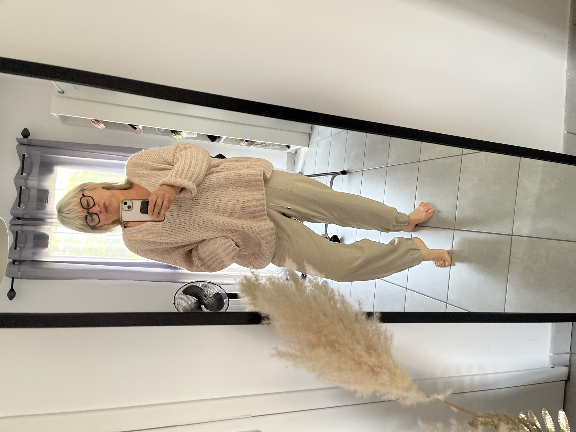 Woman takes mirror selfie in Chambœuf, France