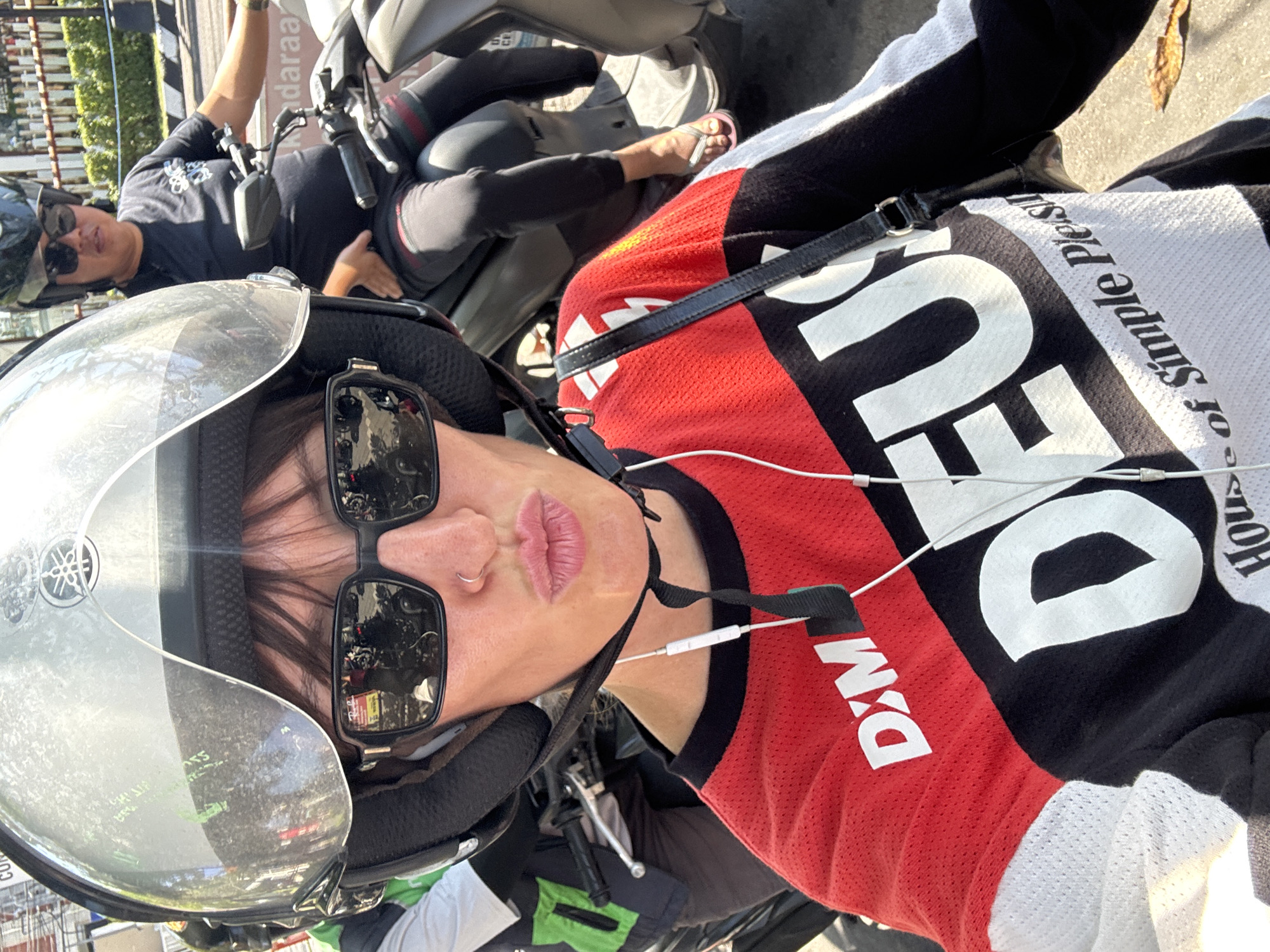 Scooter crew fuels up and takes helmet selfies in North Kuta
