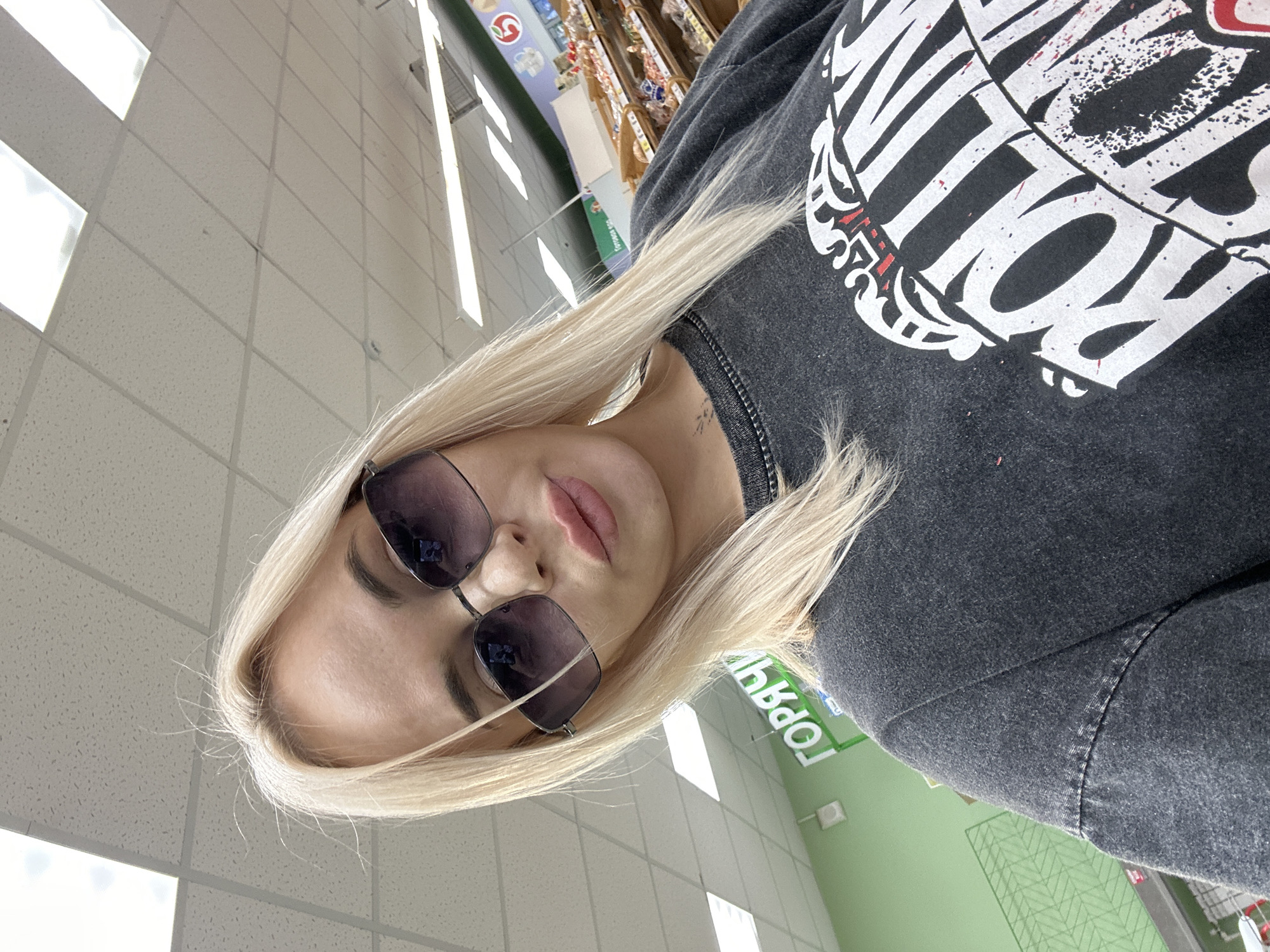 Woman documents shopping trip with selfies in Высокий, Russia