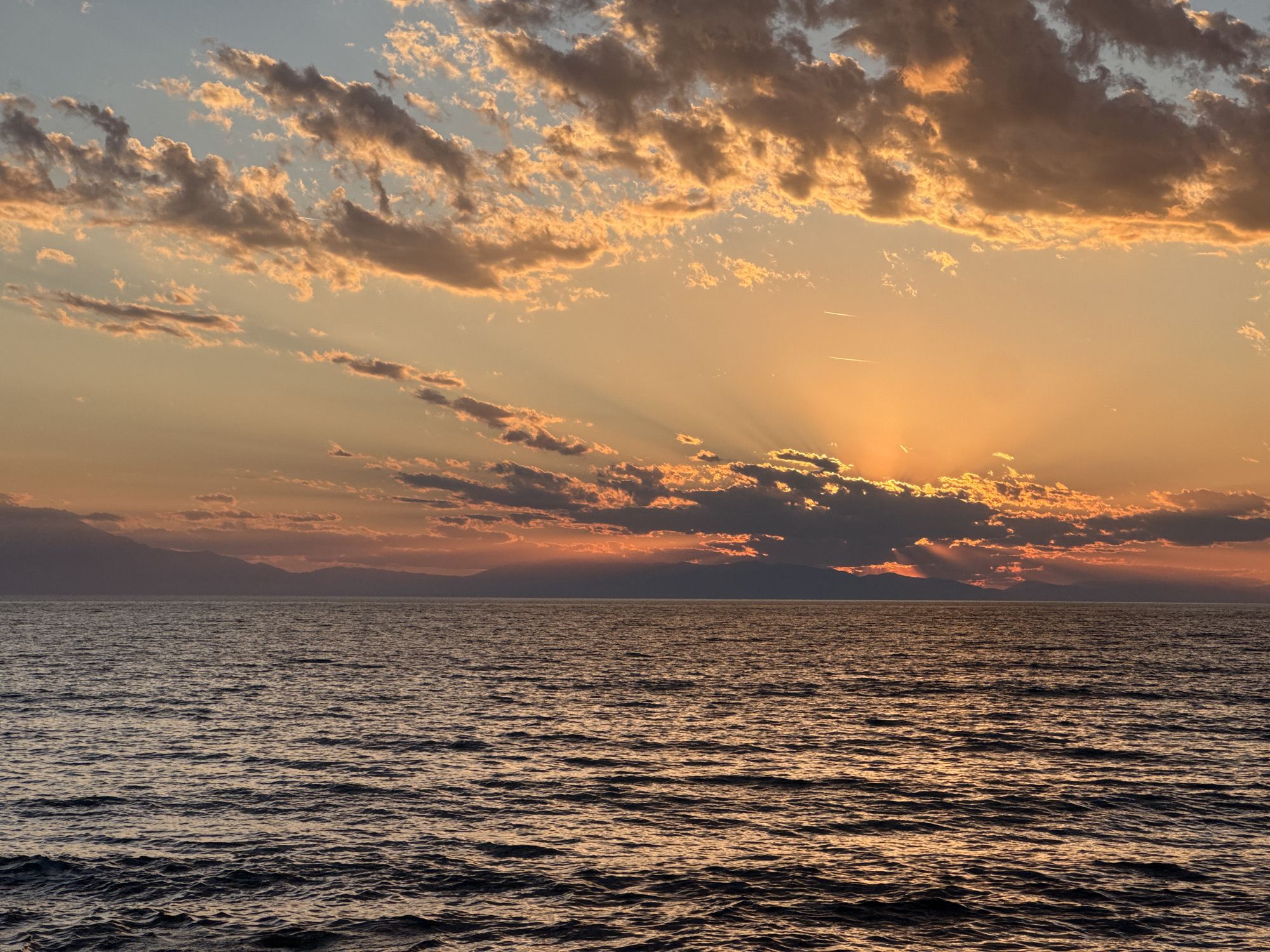 Golden sunset observed over waters near Nea Potidea, Greece