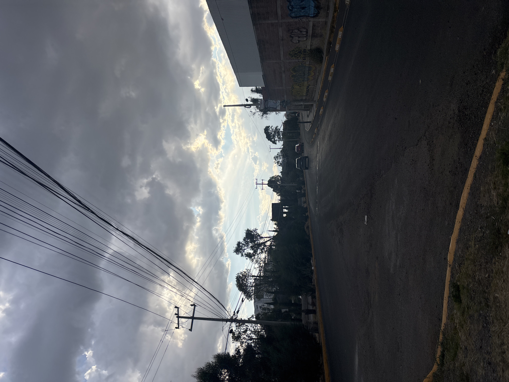 Street scene captured under cloudy sky in San Pedro Cholula