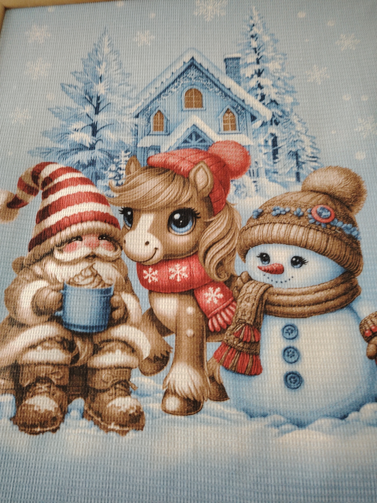Christmas artwork featuring Santa, pony, gnomes observed on wall
